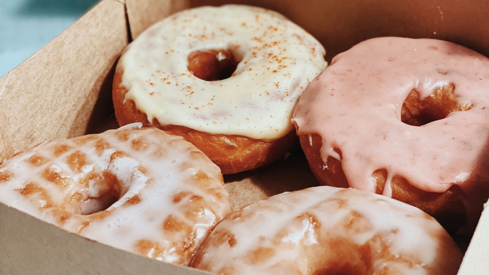 brown and white doughnuts in box