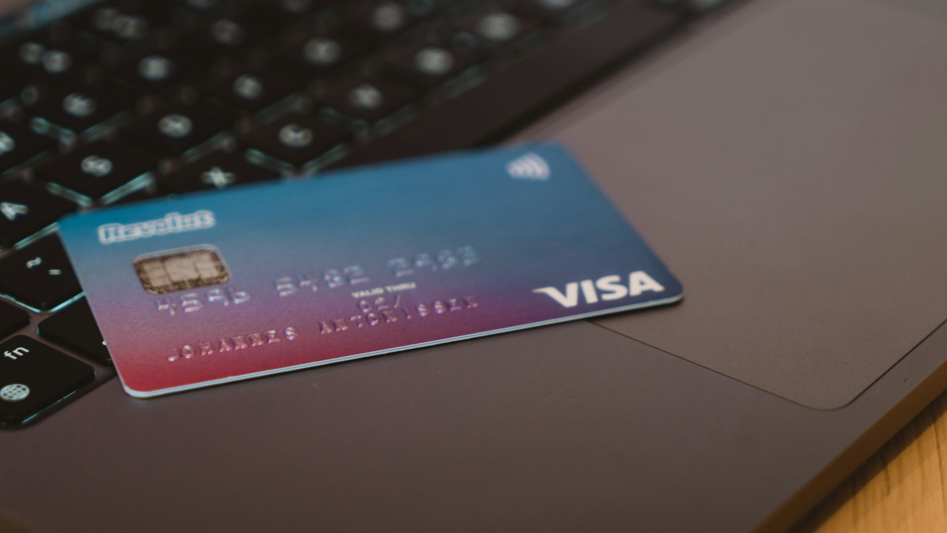 blue and white visa card on silver laptop computer