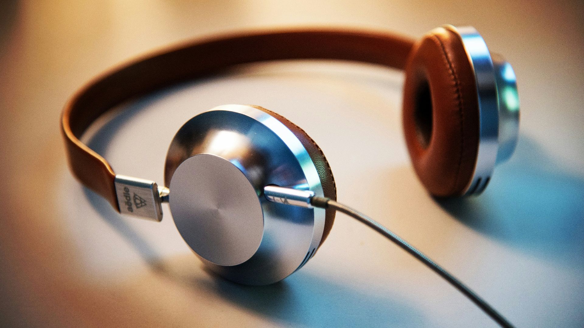 gray and brown corded headphones