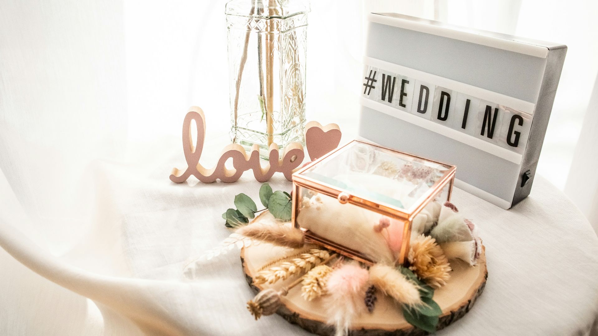 a table topped with a wooden slice of cake