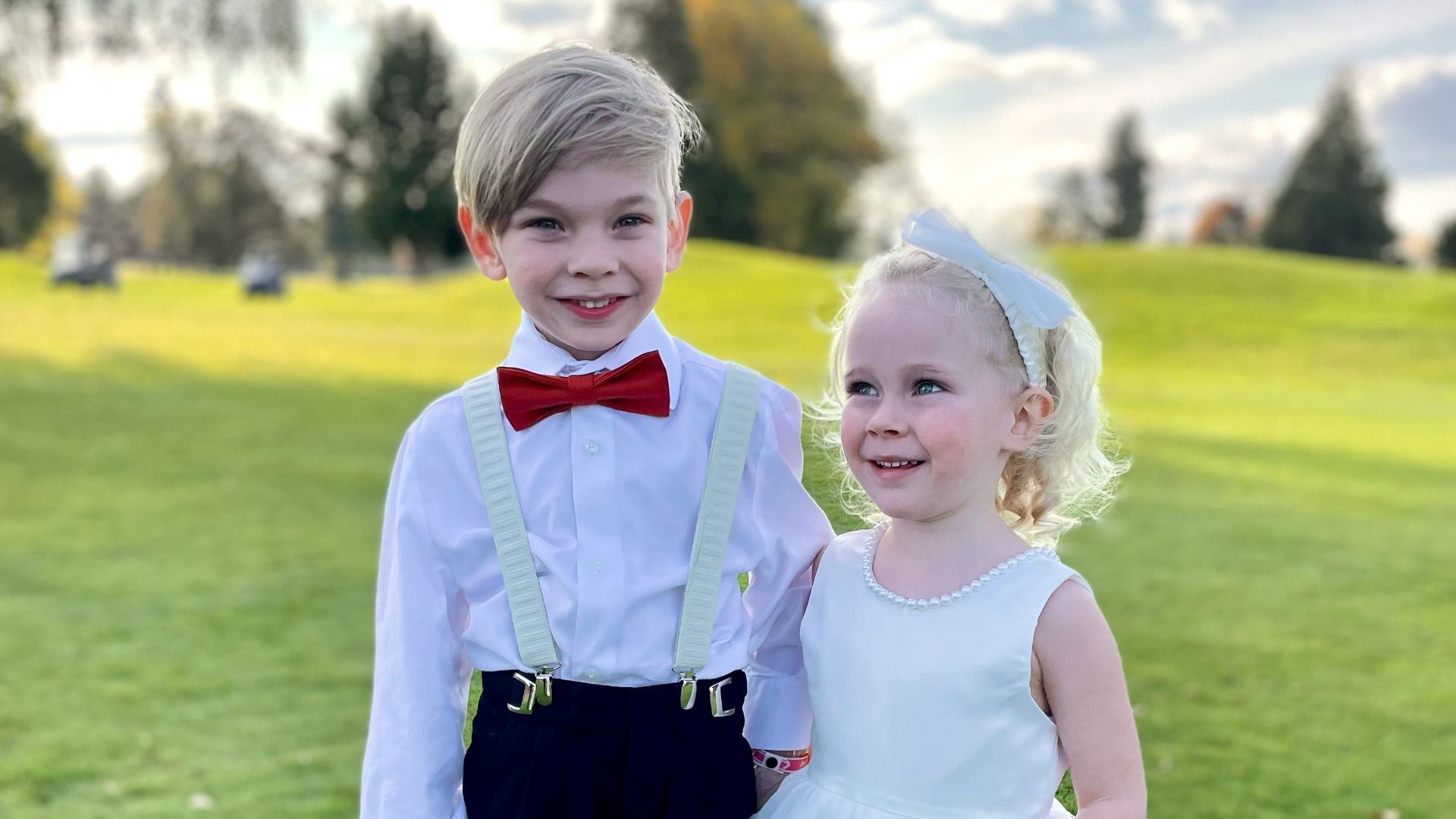 a boy and girl in formal wear