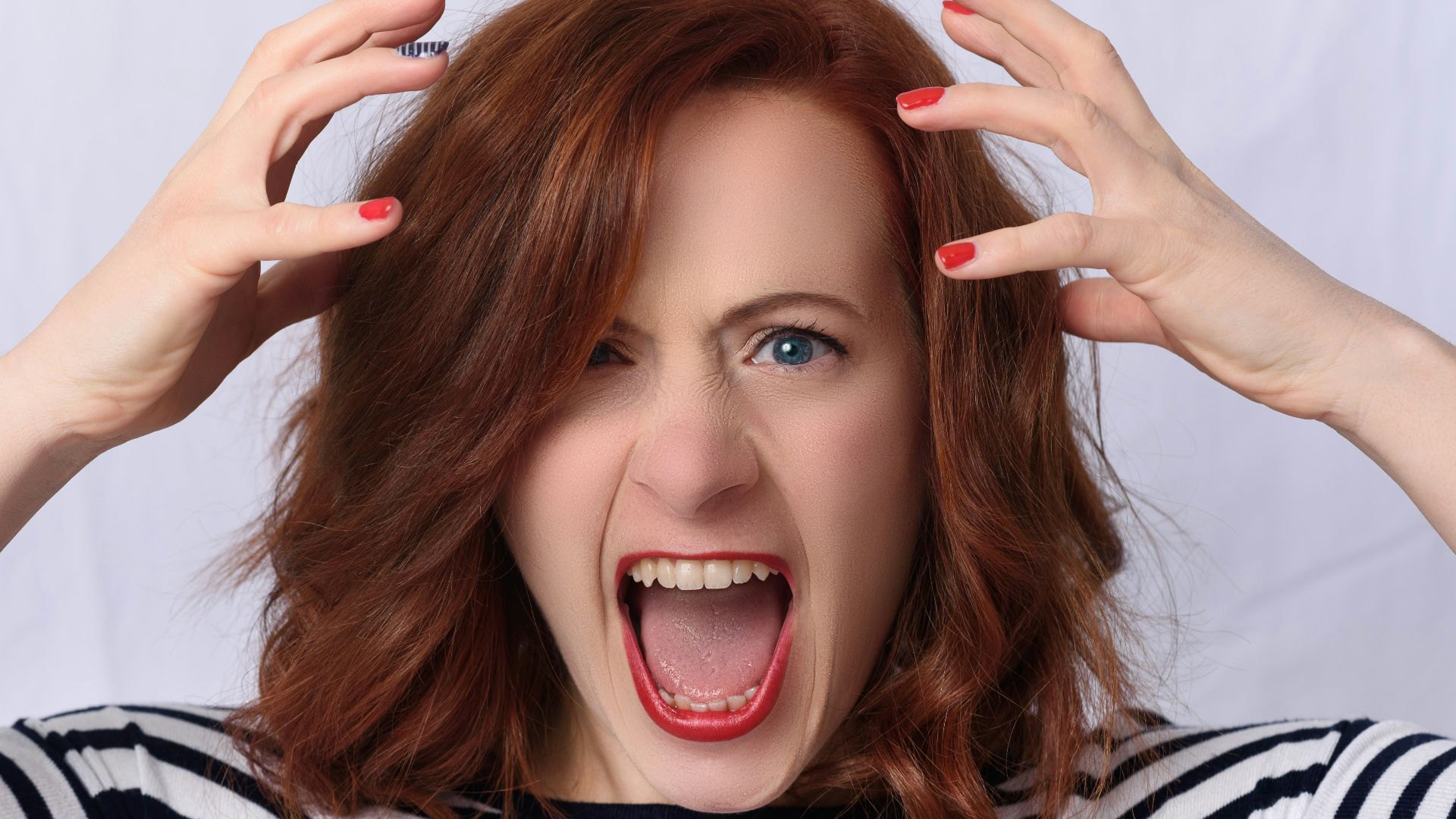 smiling girl in black and white striped shirt