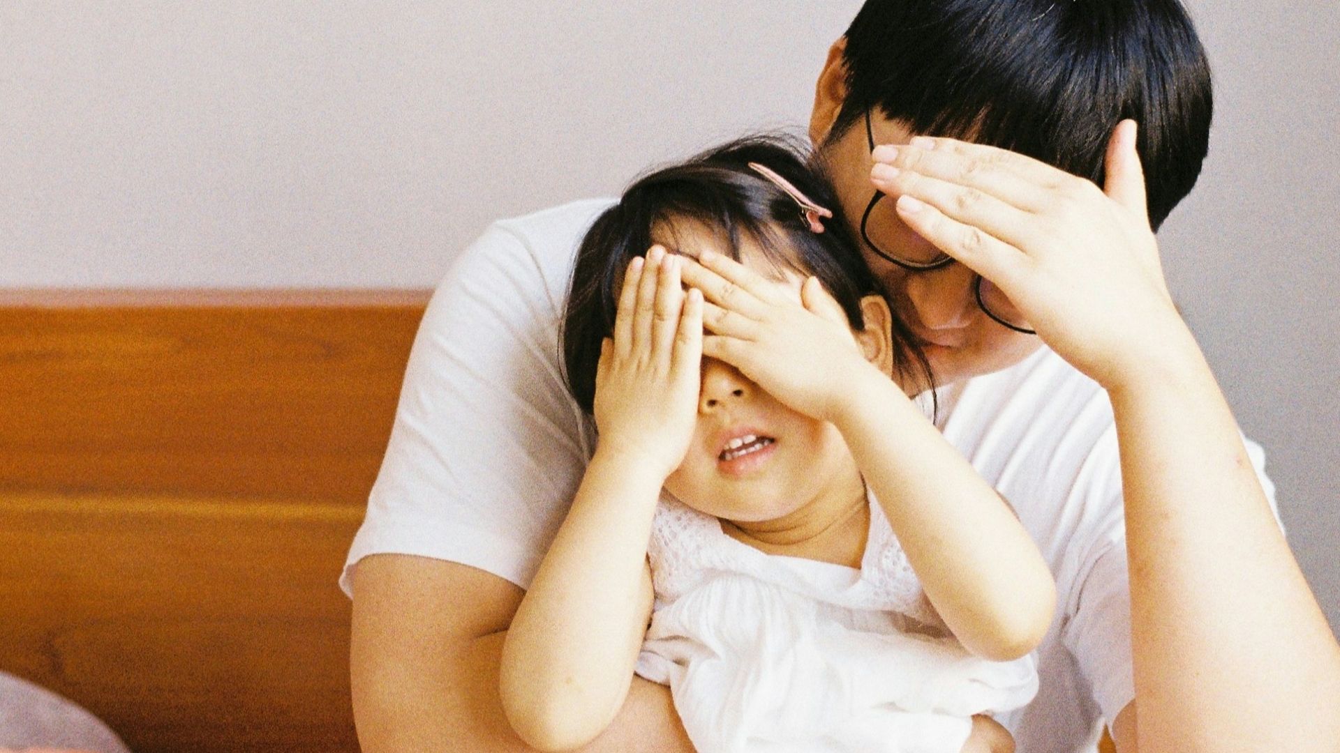 woman in white dress lying on bed