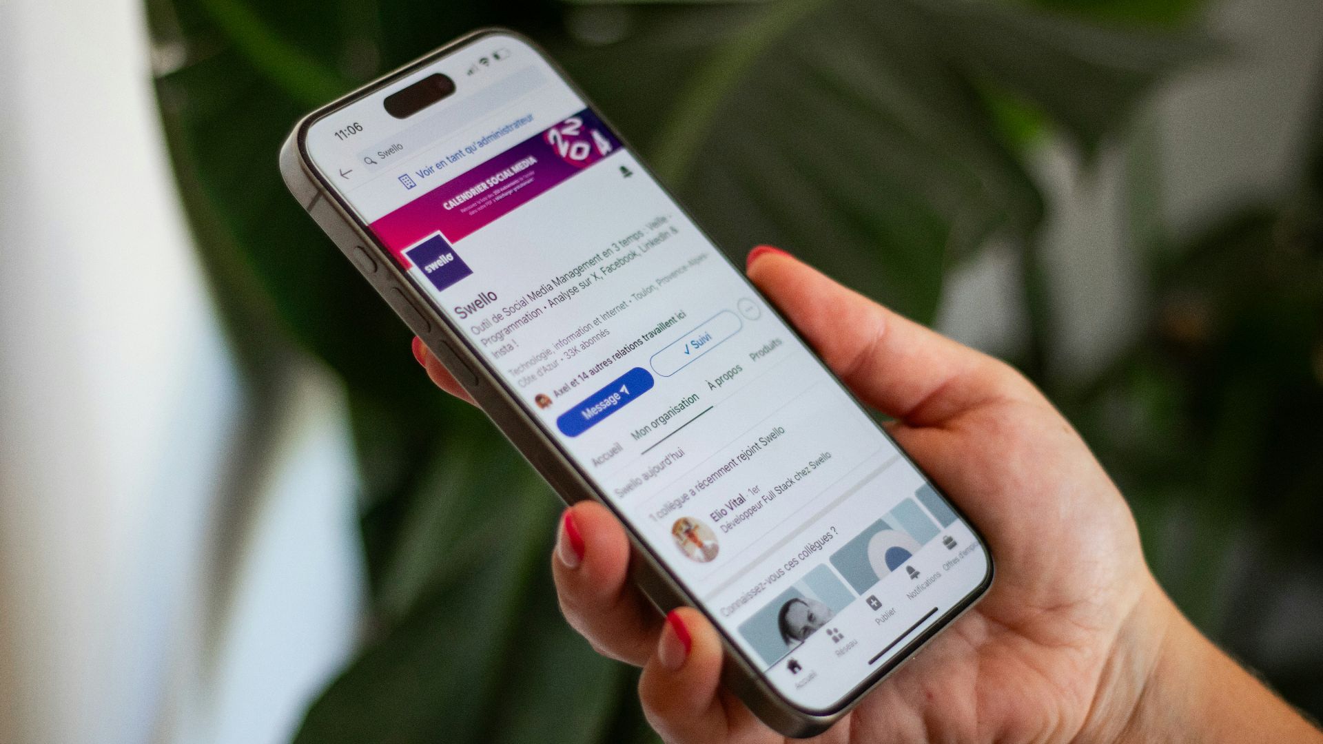 A person holding a cell phone in their hand