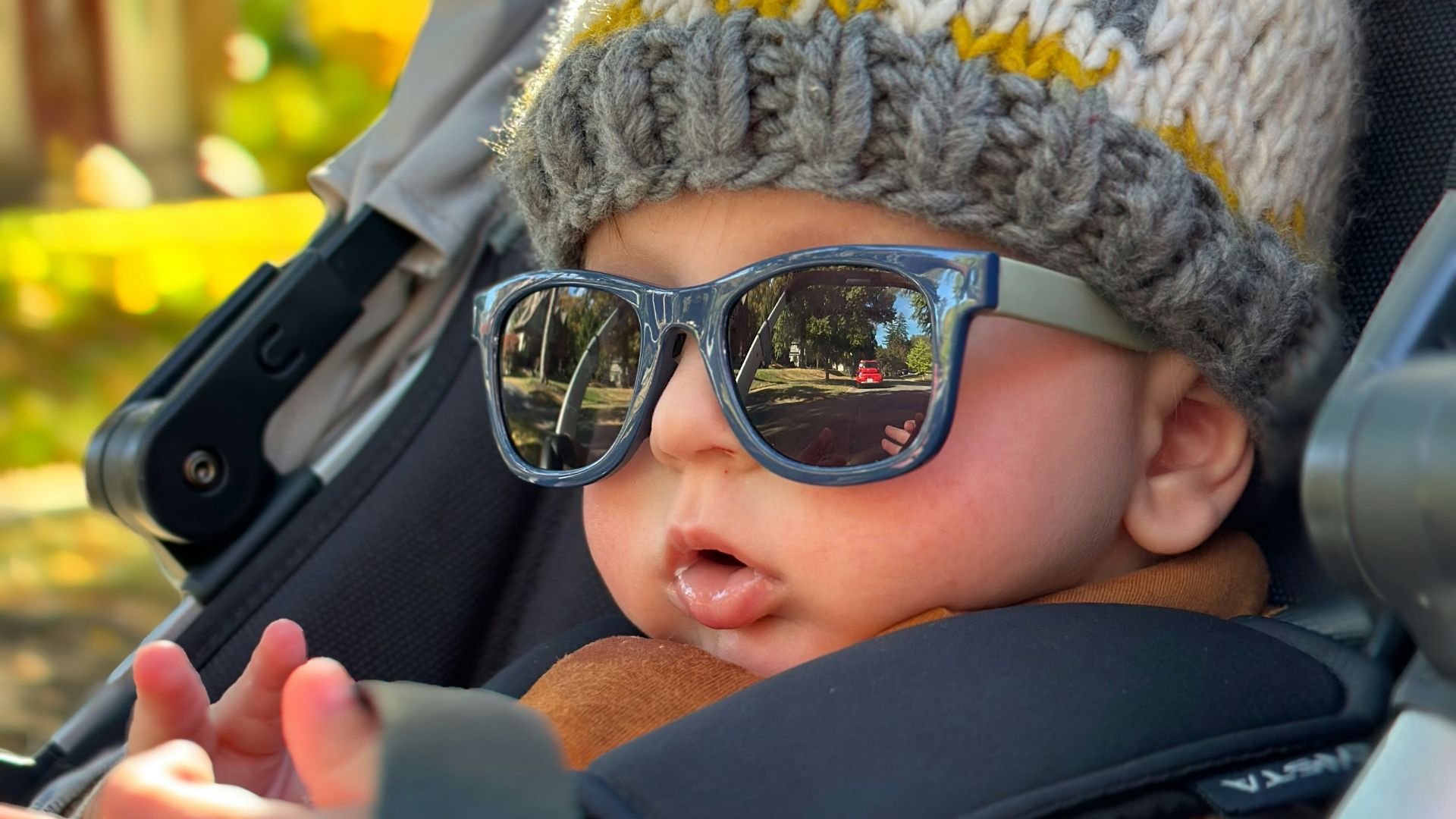 a baby wearing sunglasses and a hat