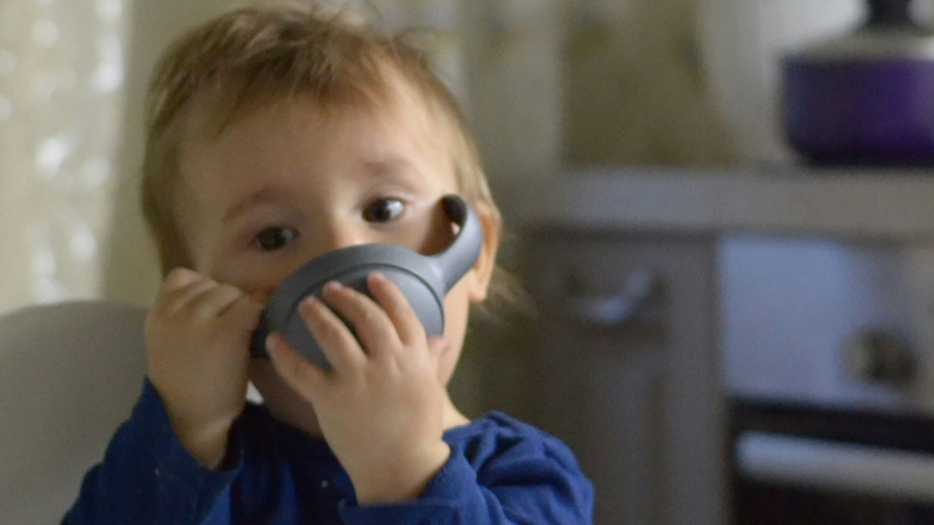 a boy holding a phone