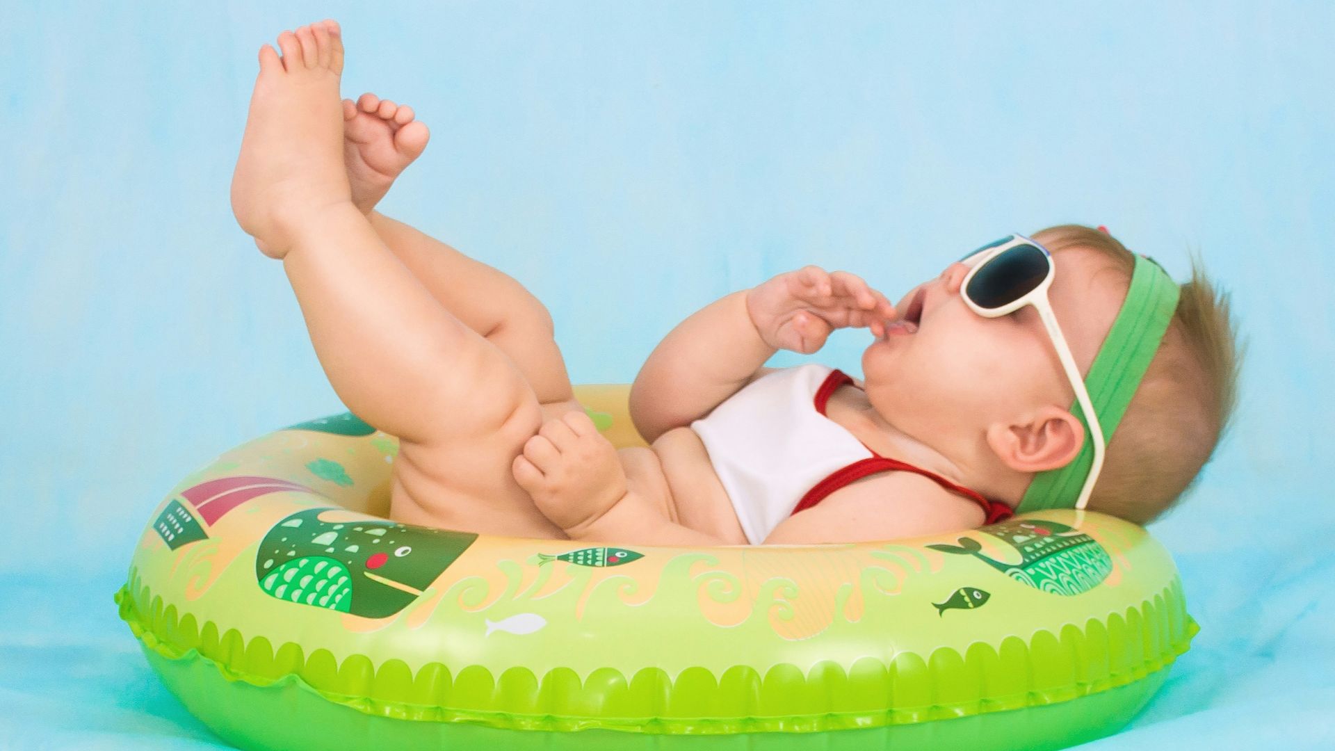 baby lying on inflatable ring