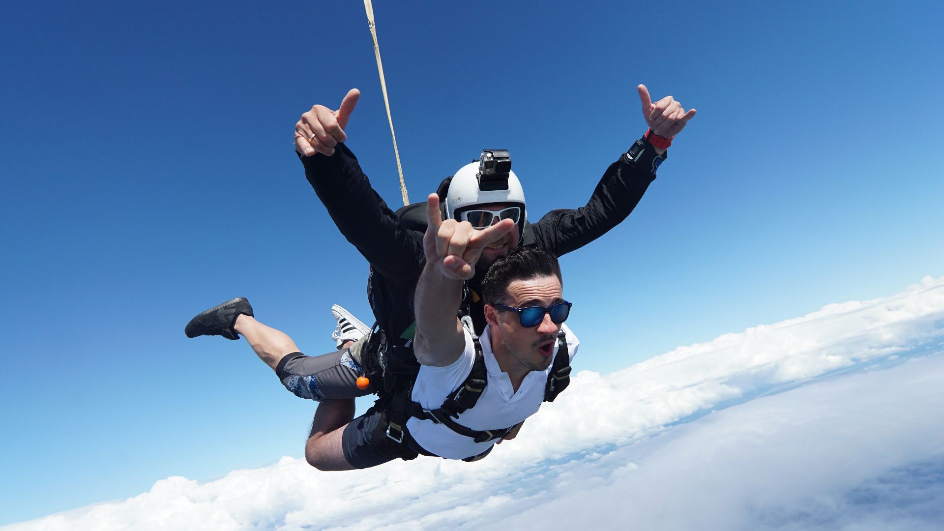 a man skydiving with a parachute
