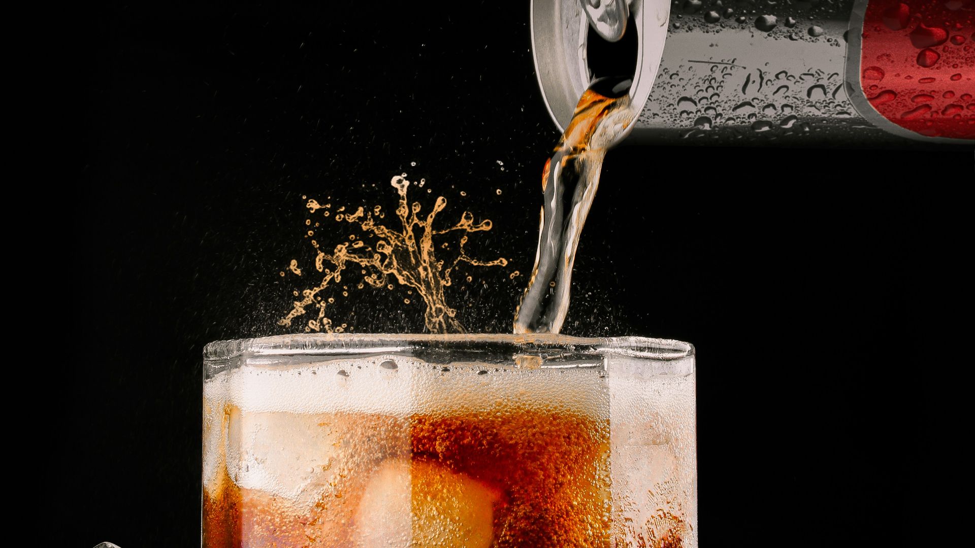 clear drinking glass with brown liquid