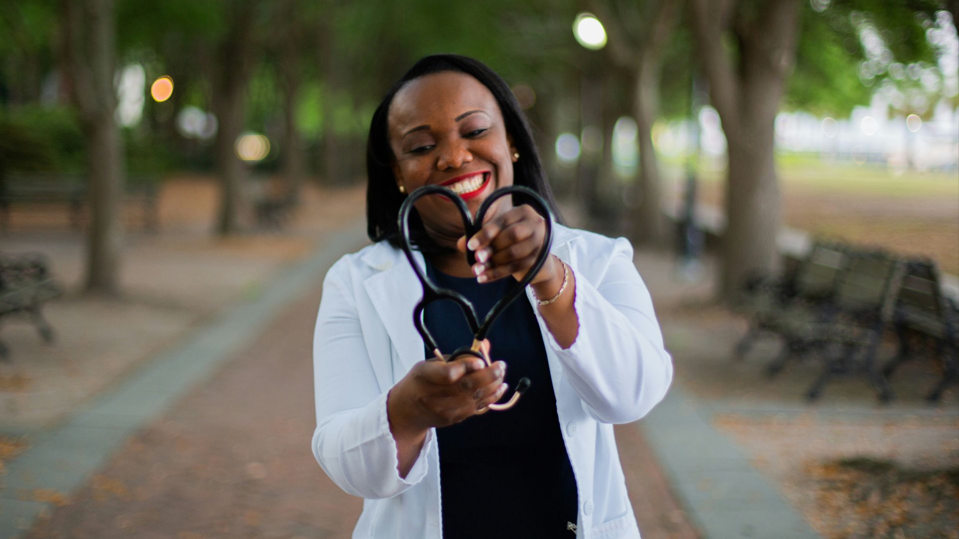 a woman holding a pair of scissors in her hands