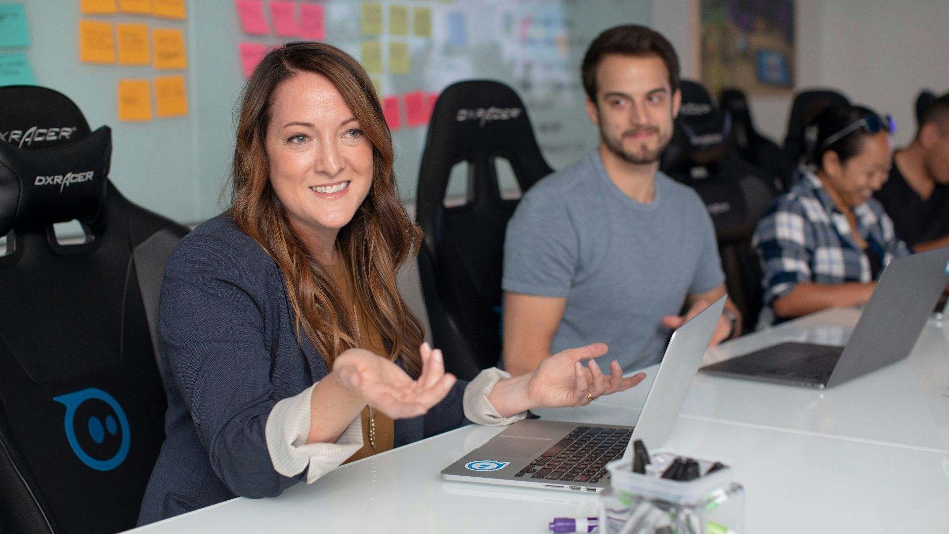 woman in black long sleeve shirt sitting beside man in gray crew neck shirt