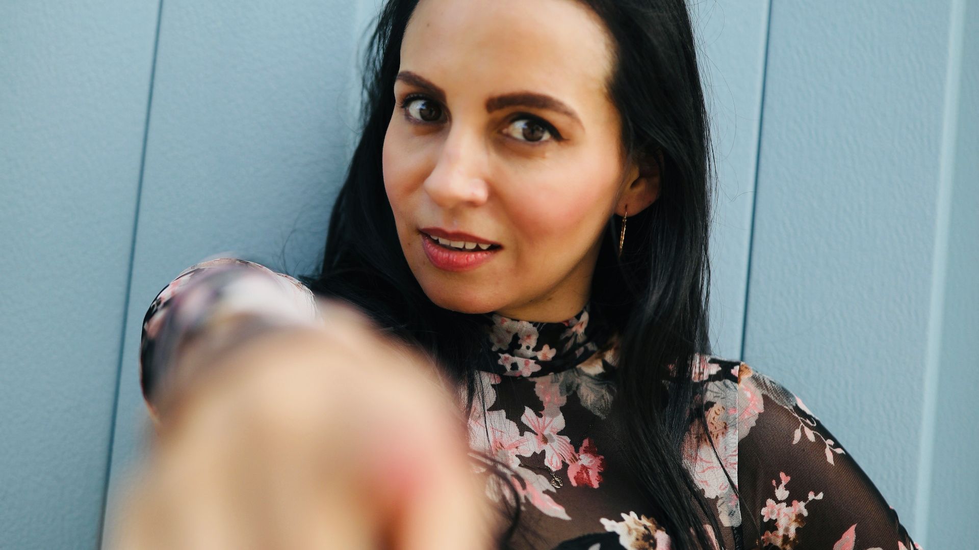 woman in black and white floral long sleeve shirt