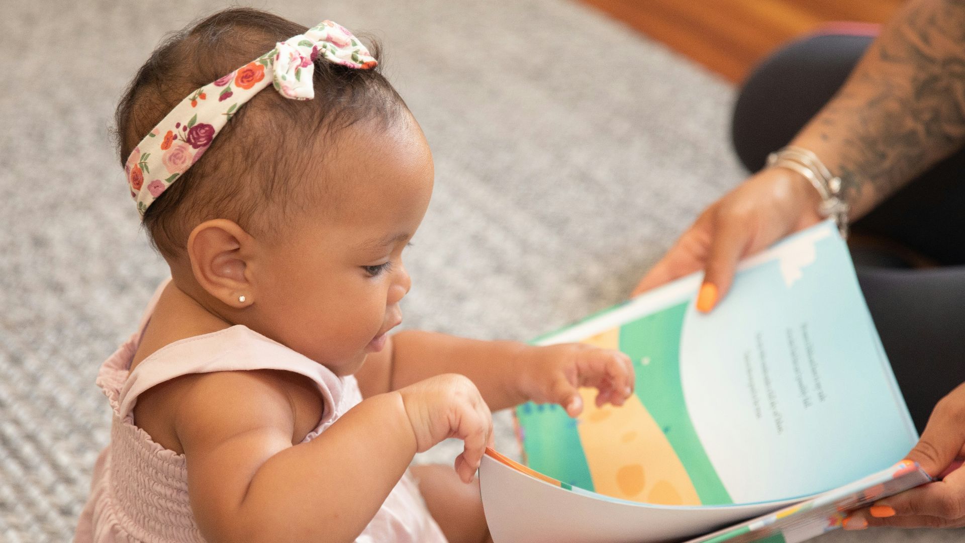 a baby reading a book