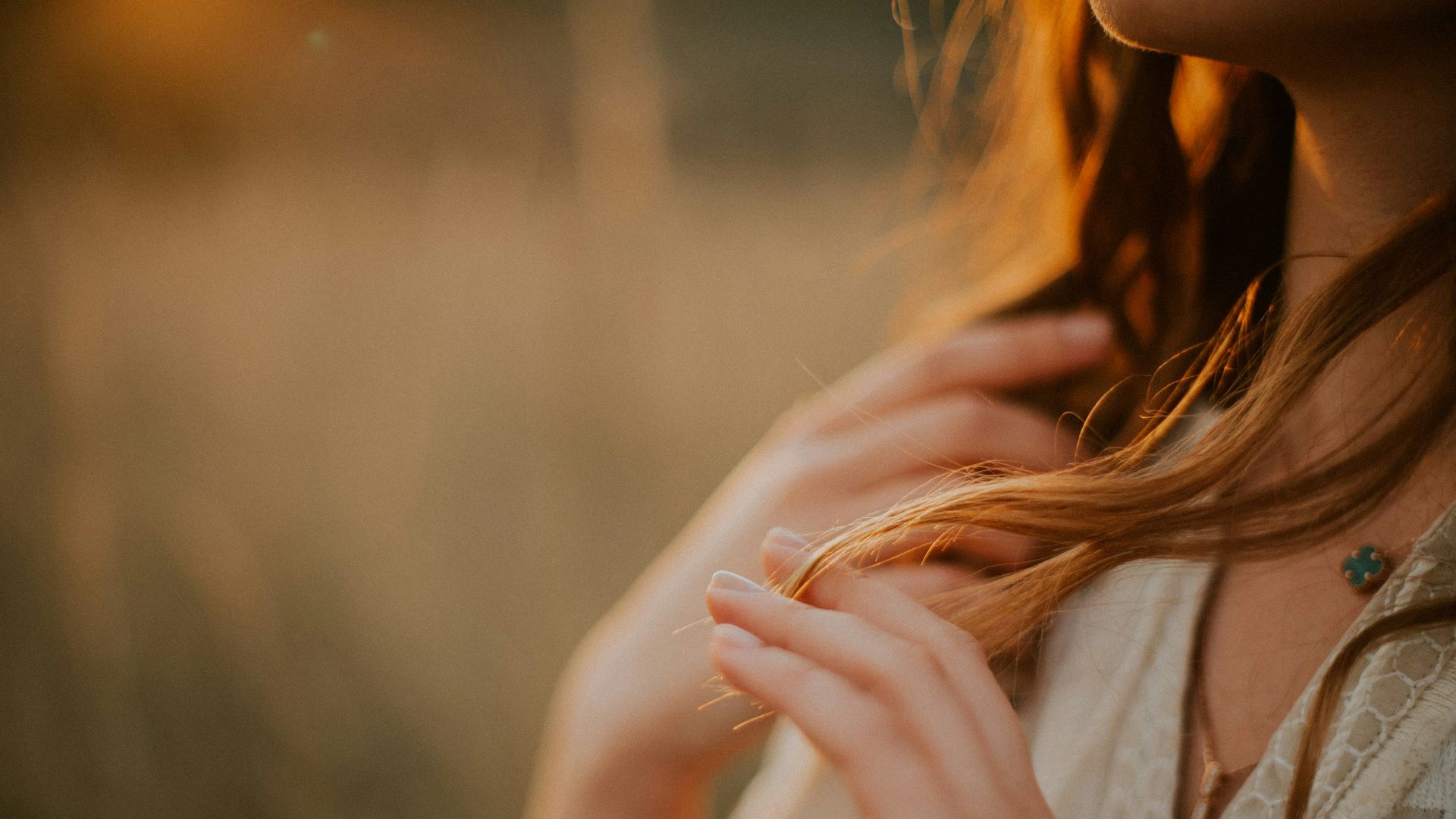a woman with her hands together