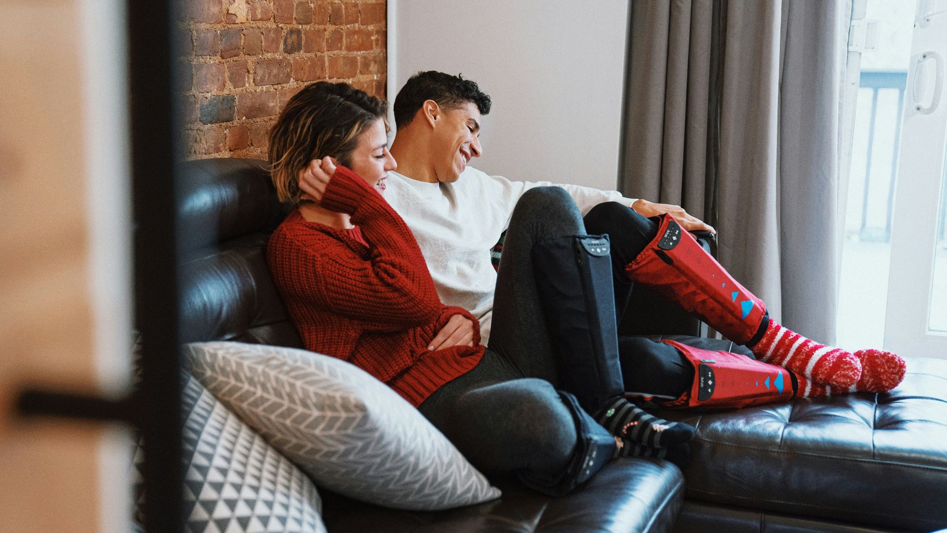a man and woman sitting on a couch