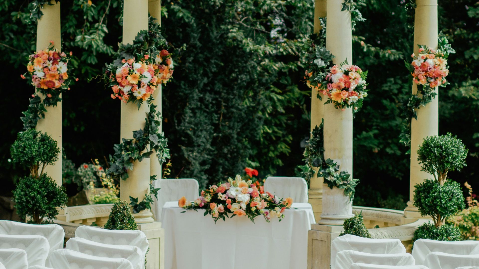 gray and beige gazebo near green leafed tree