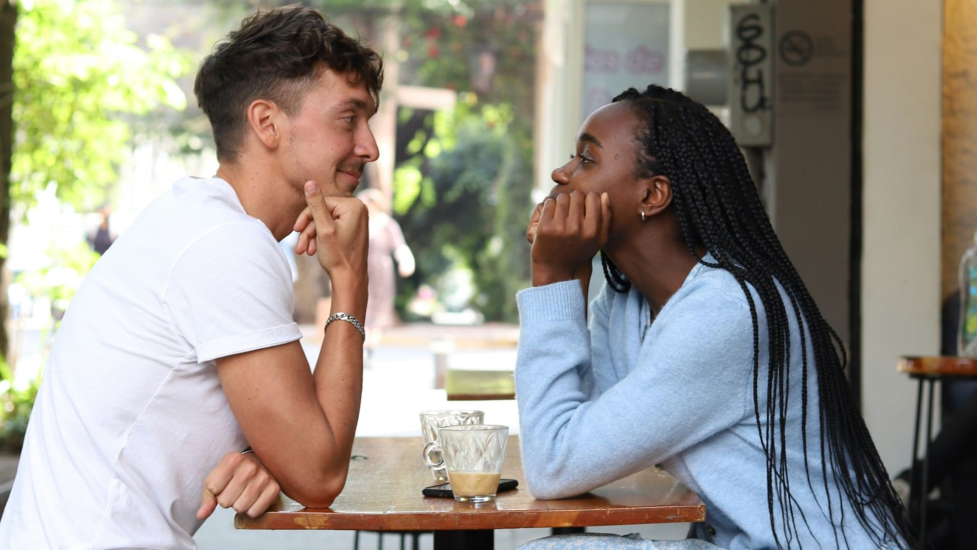 a man and a woman sitting at a table
