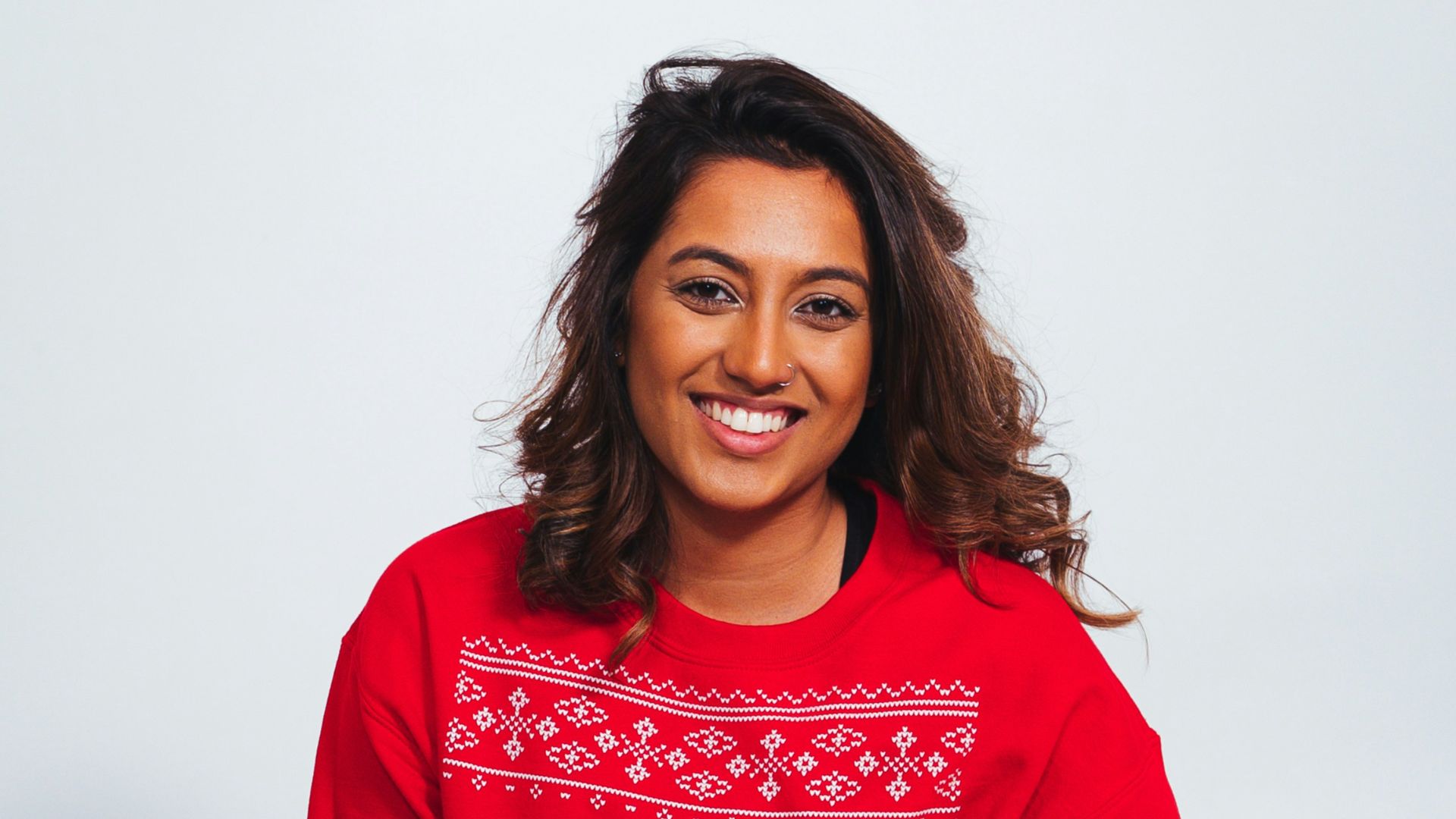 woman in red sweatshirt and black pants