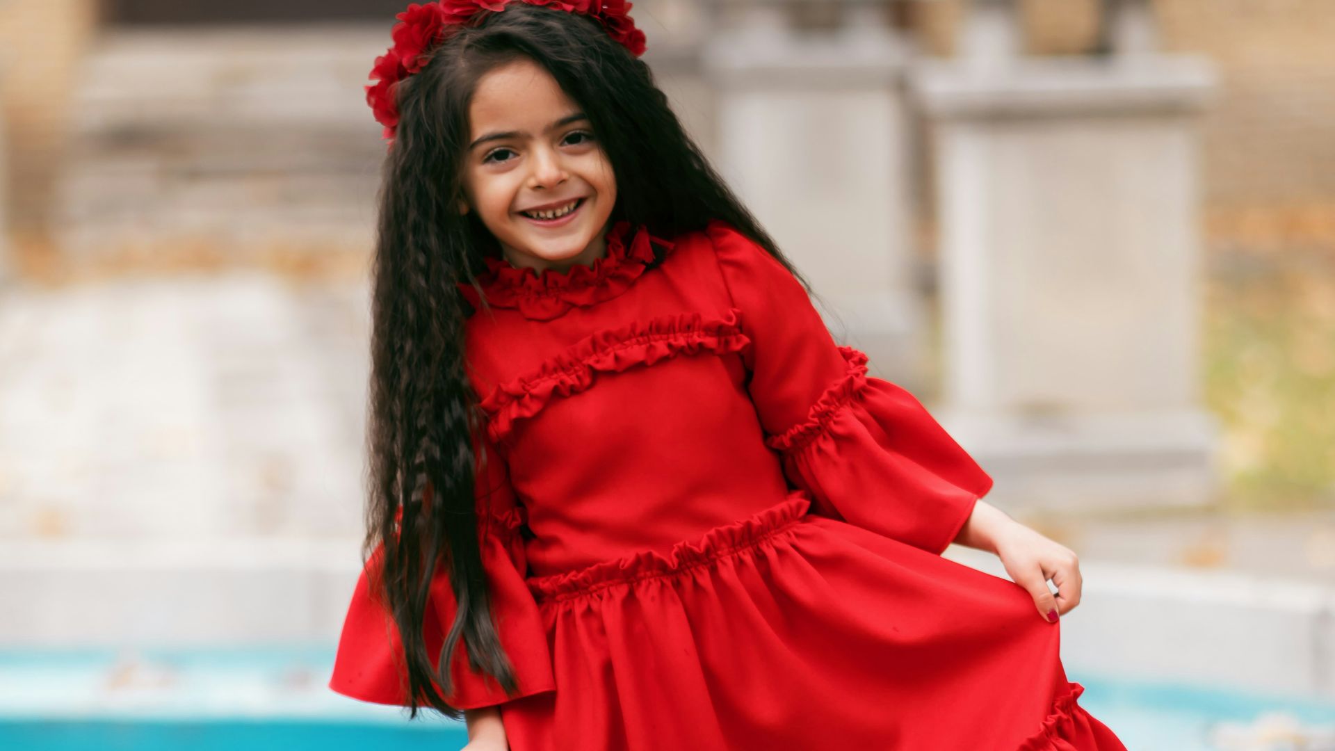 smiling girl holding her dress