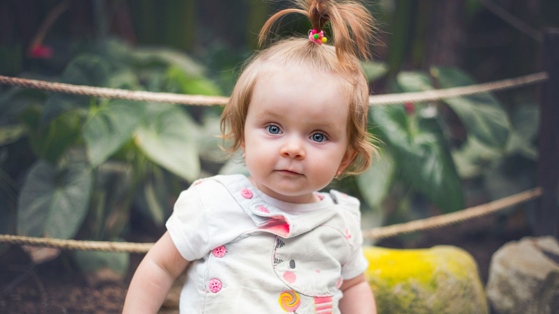 girl in white and pink floral dress