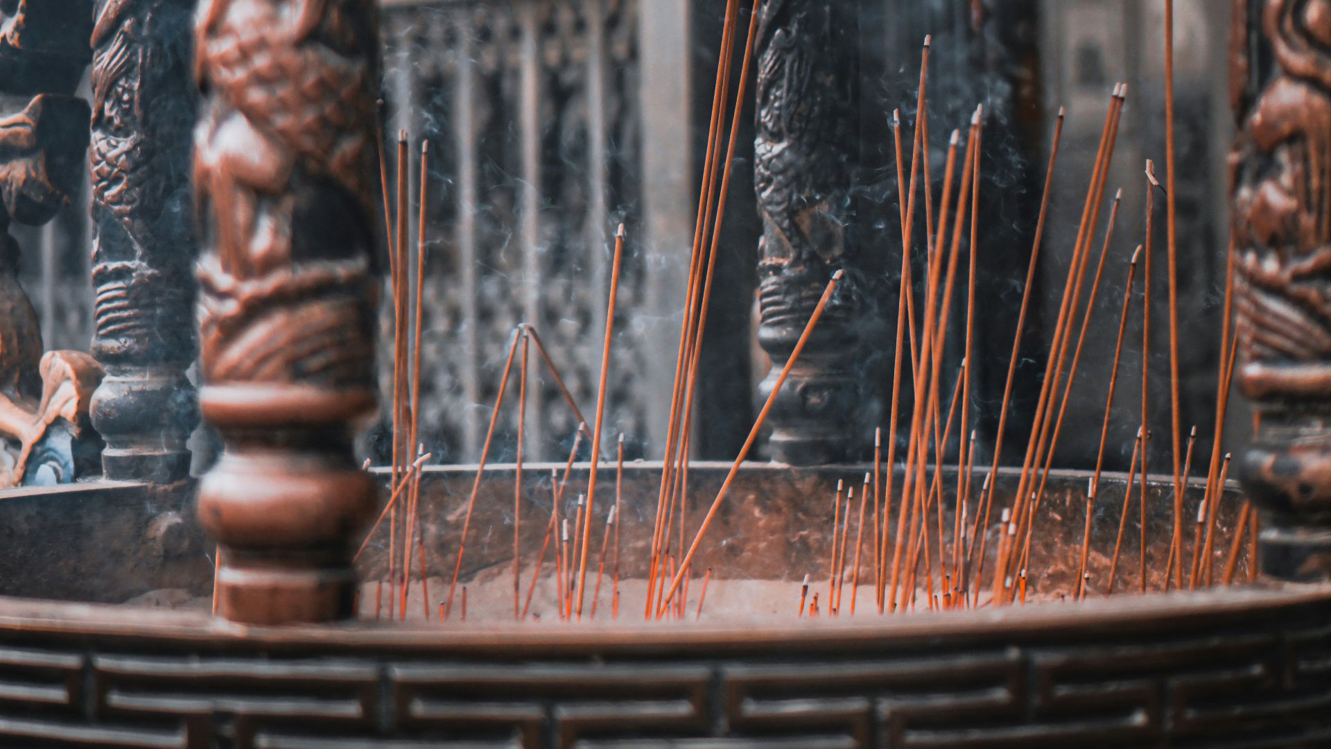 brown wooden figurine on brown wooden table