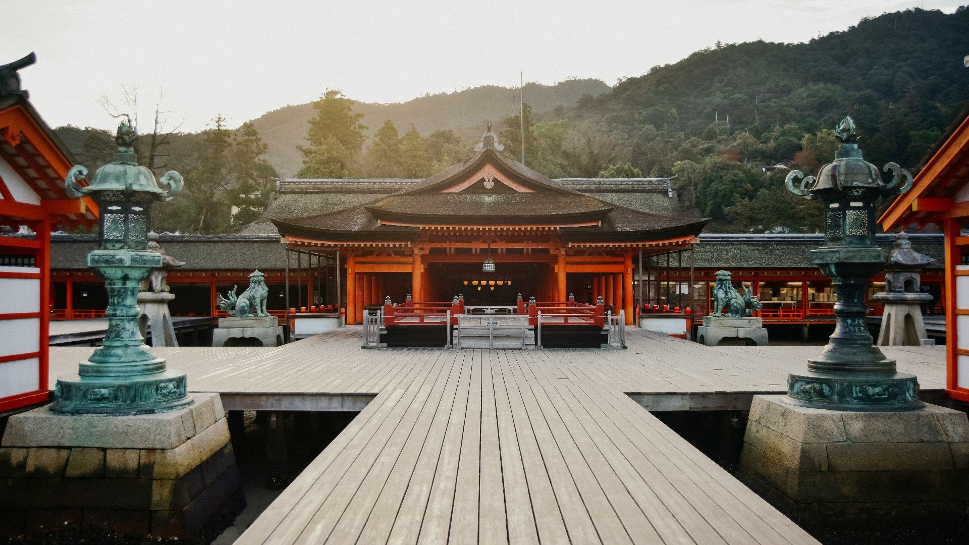 brown wooden gazebo near green trees during daytime