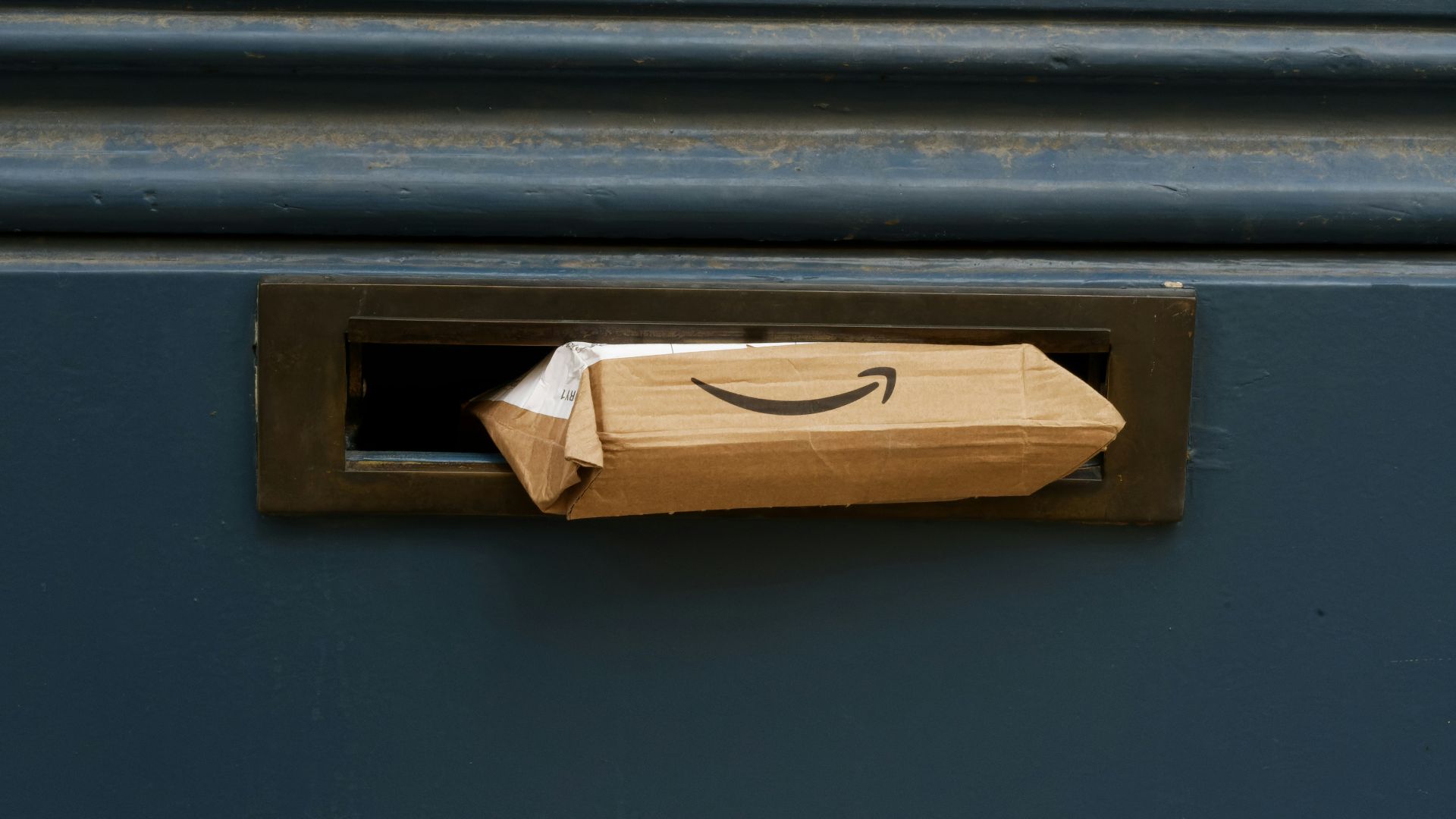 a brown paper bag with a smile drawn on it