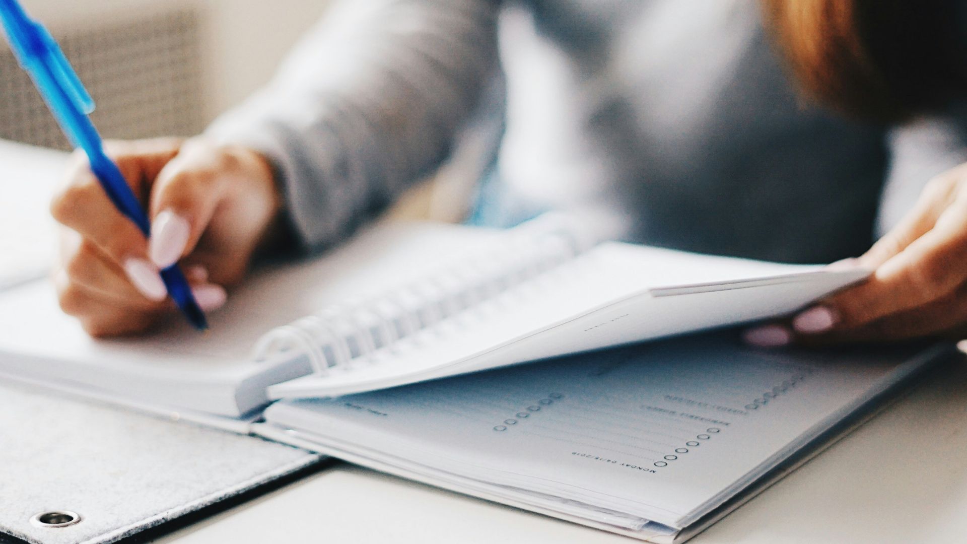 woman writing using pen