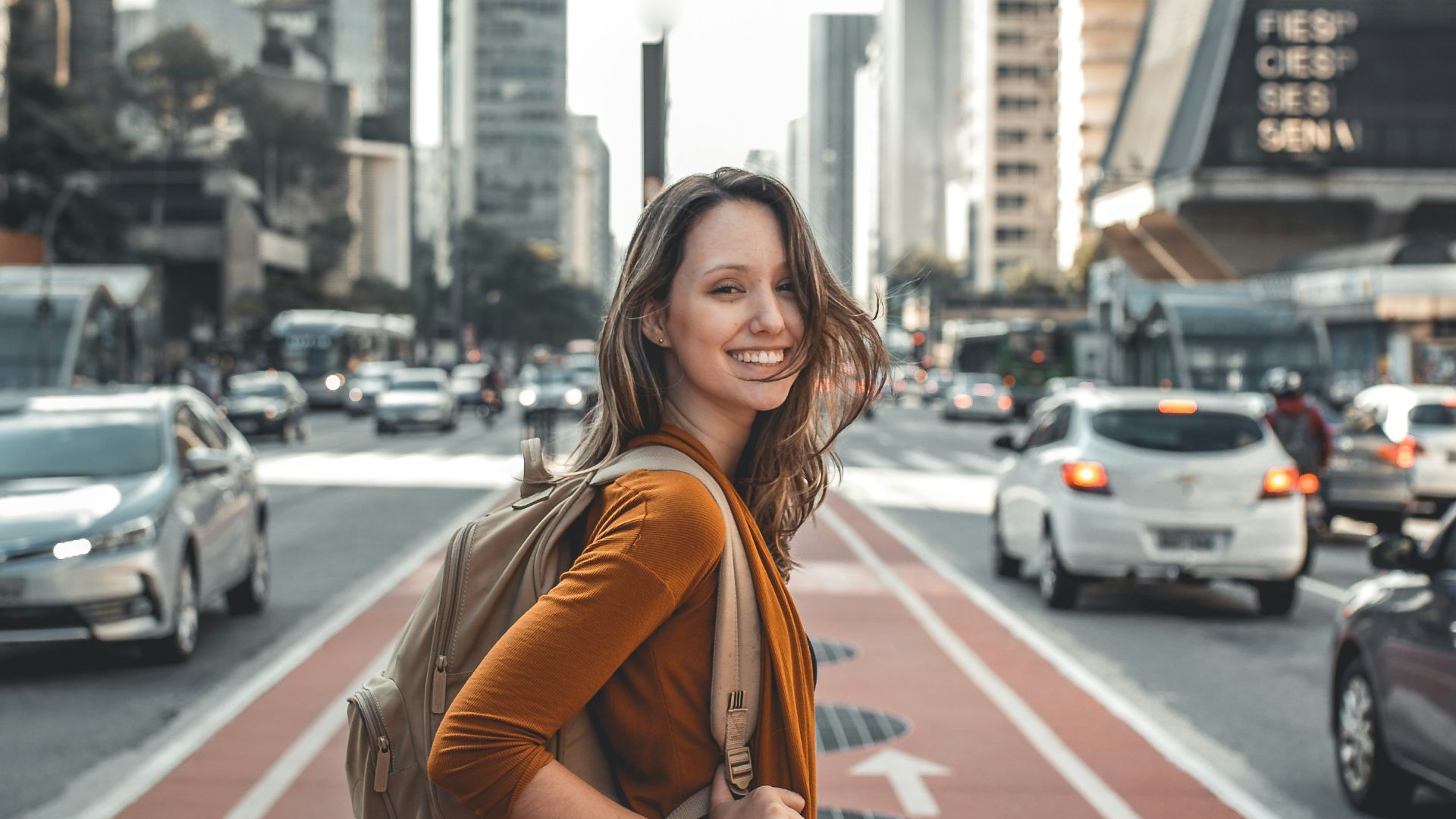 woman standing on middle of road