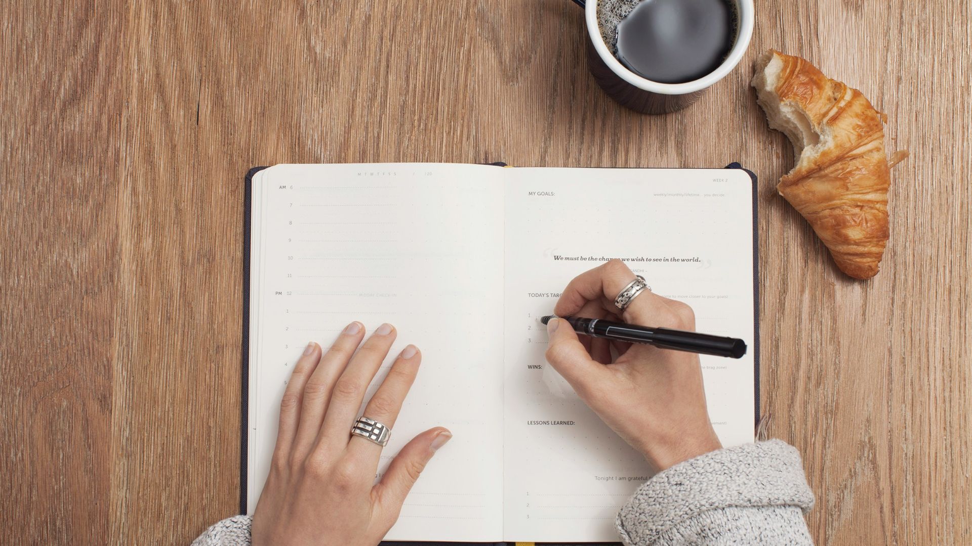 person writing on a book