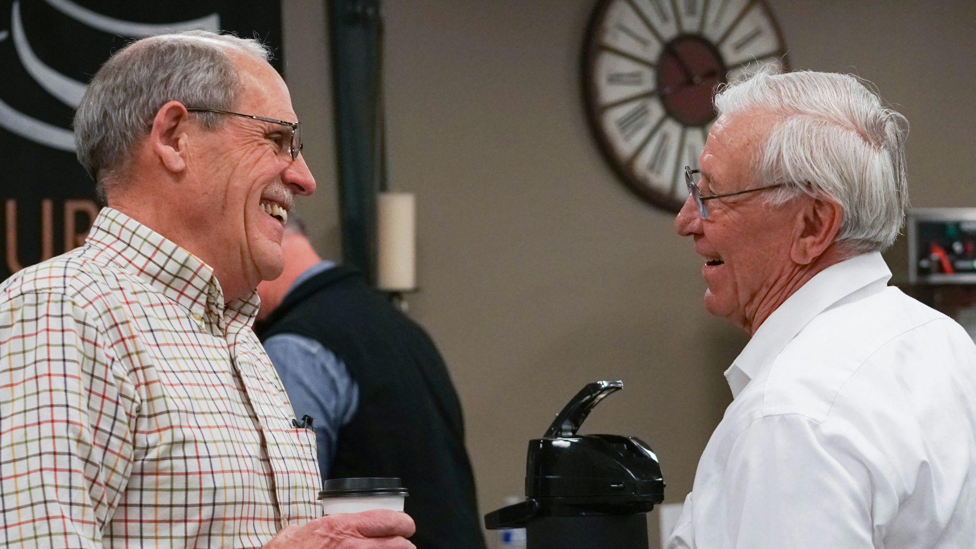 a group of people standing around each other