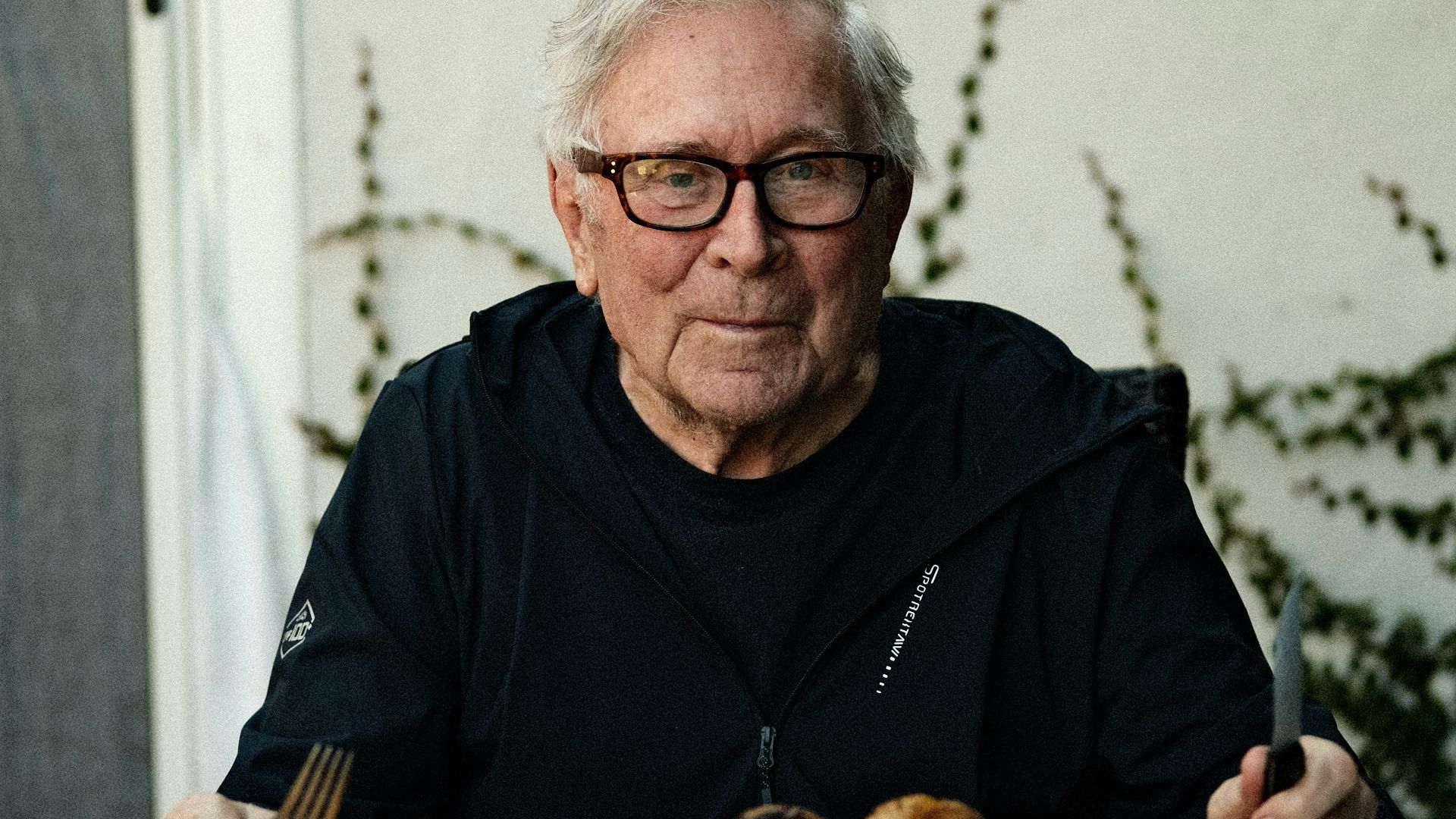 Man prepares to enjoy a feast.