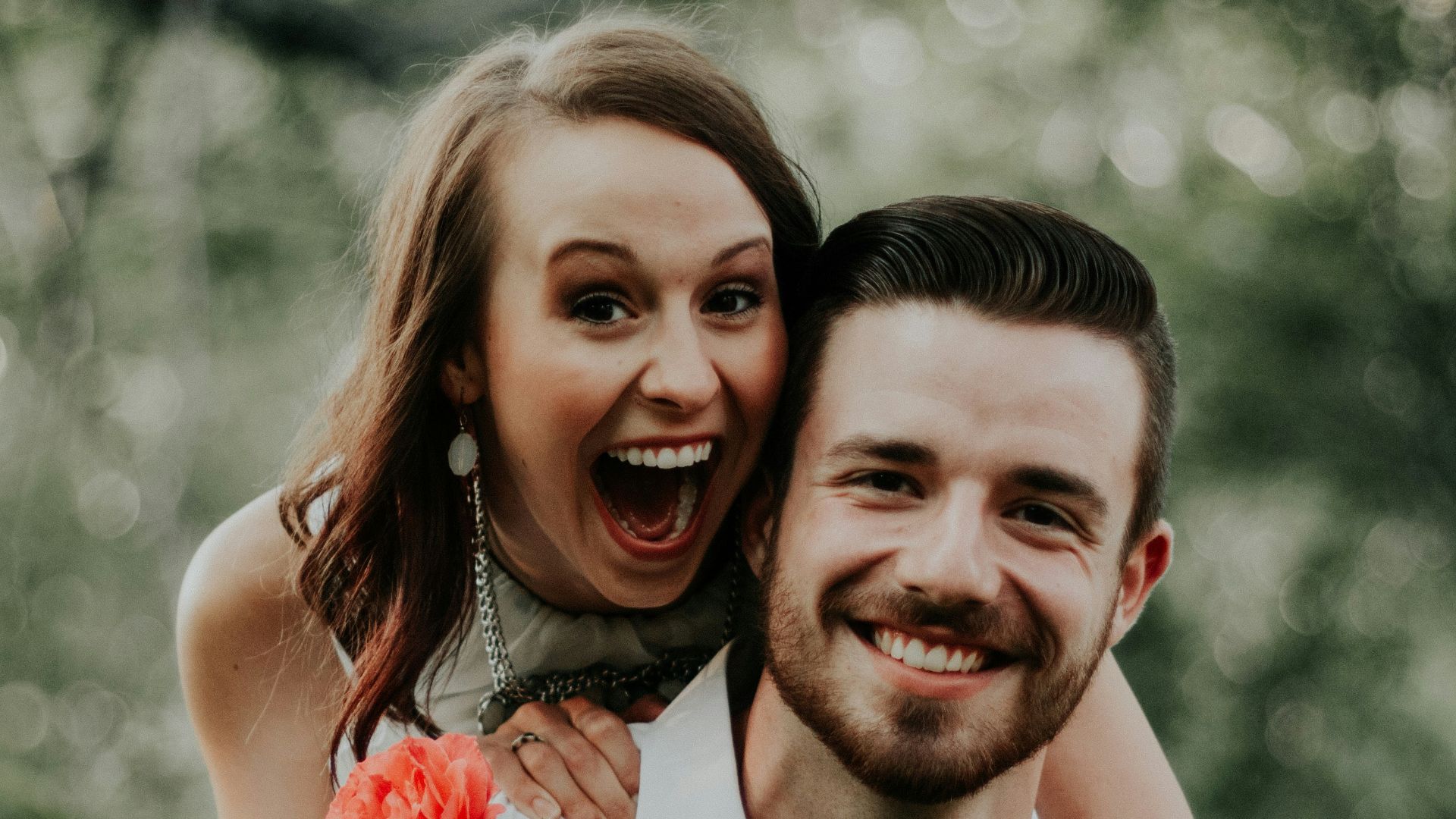 woman riding on back of man