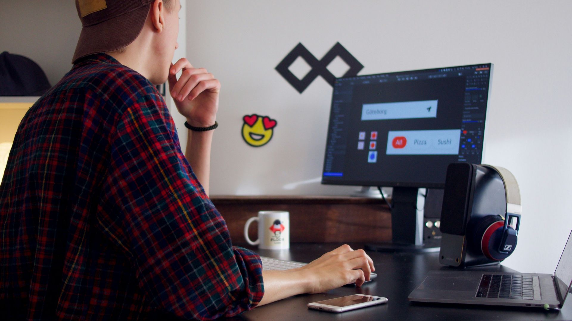 man sitting near table using computer