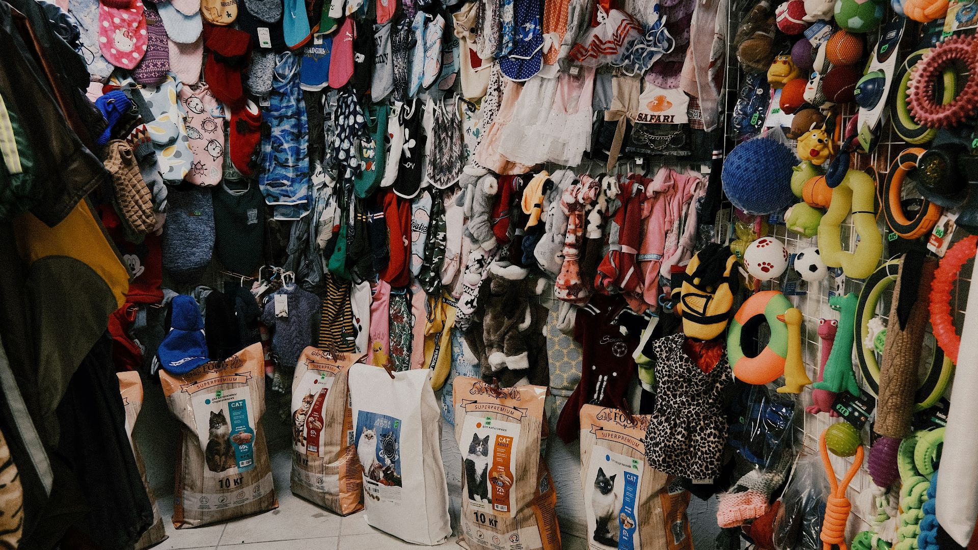assorted clothes on white steel rack