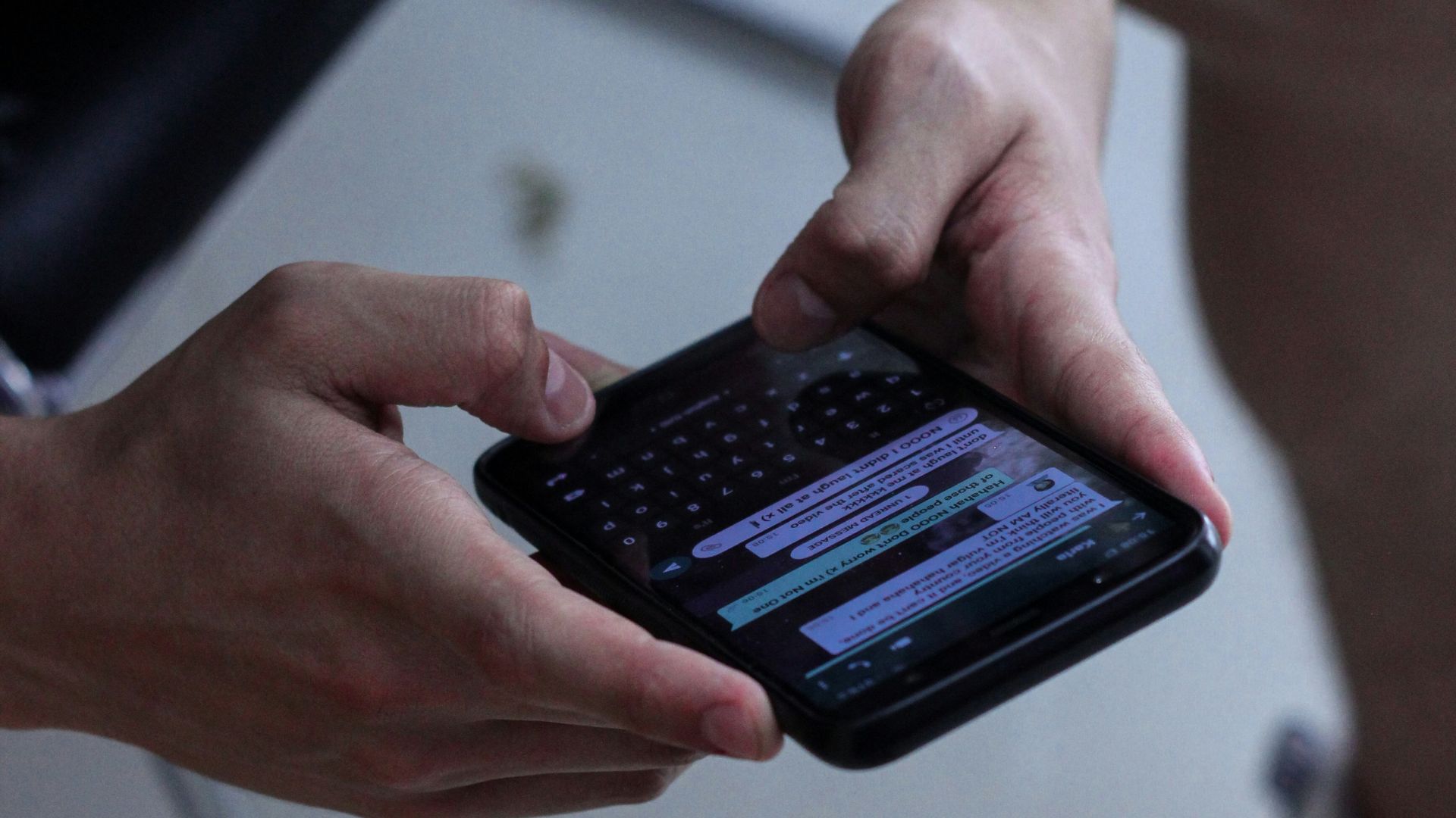 person holding black iphone 4