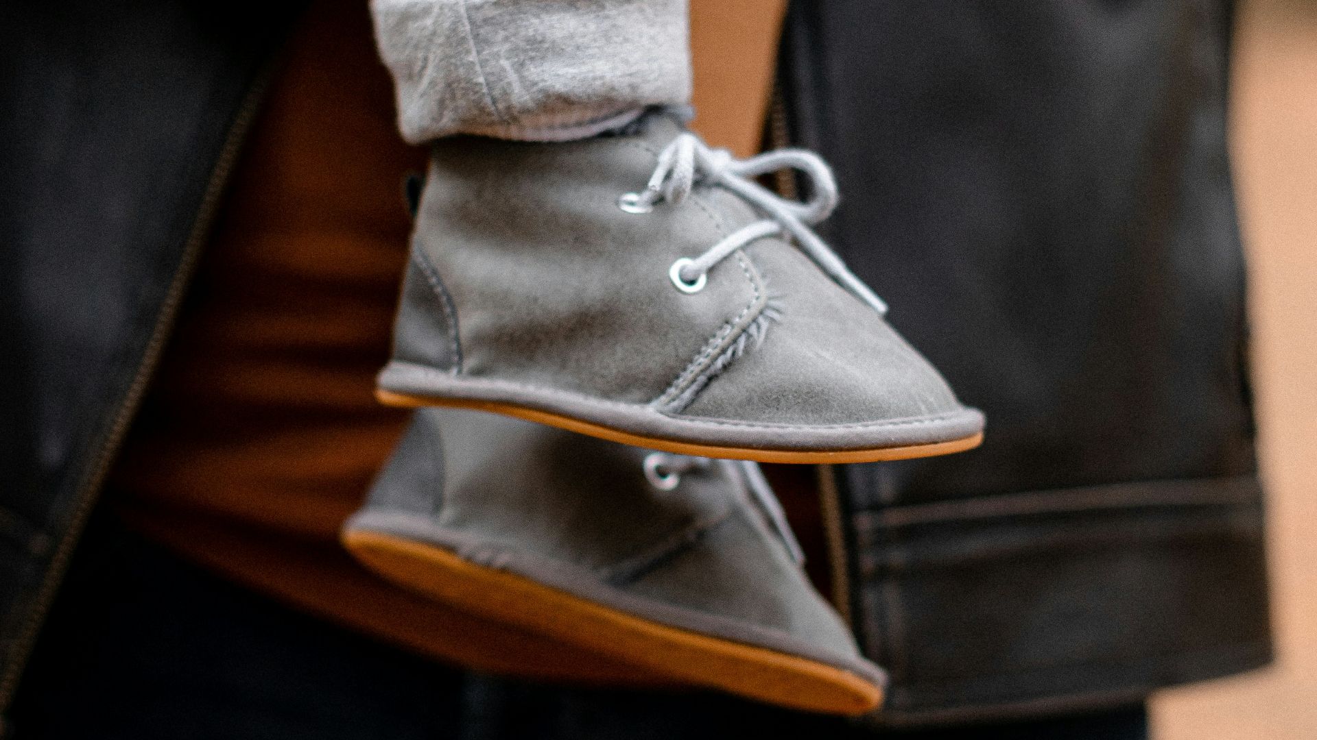 a woman holding a baby in her arms