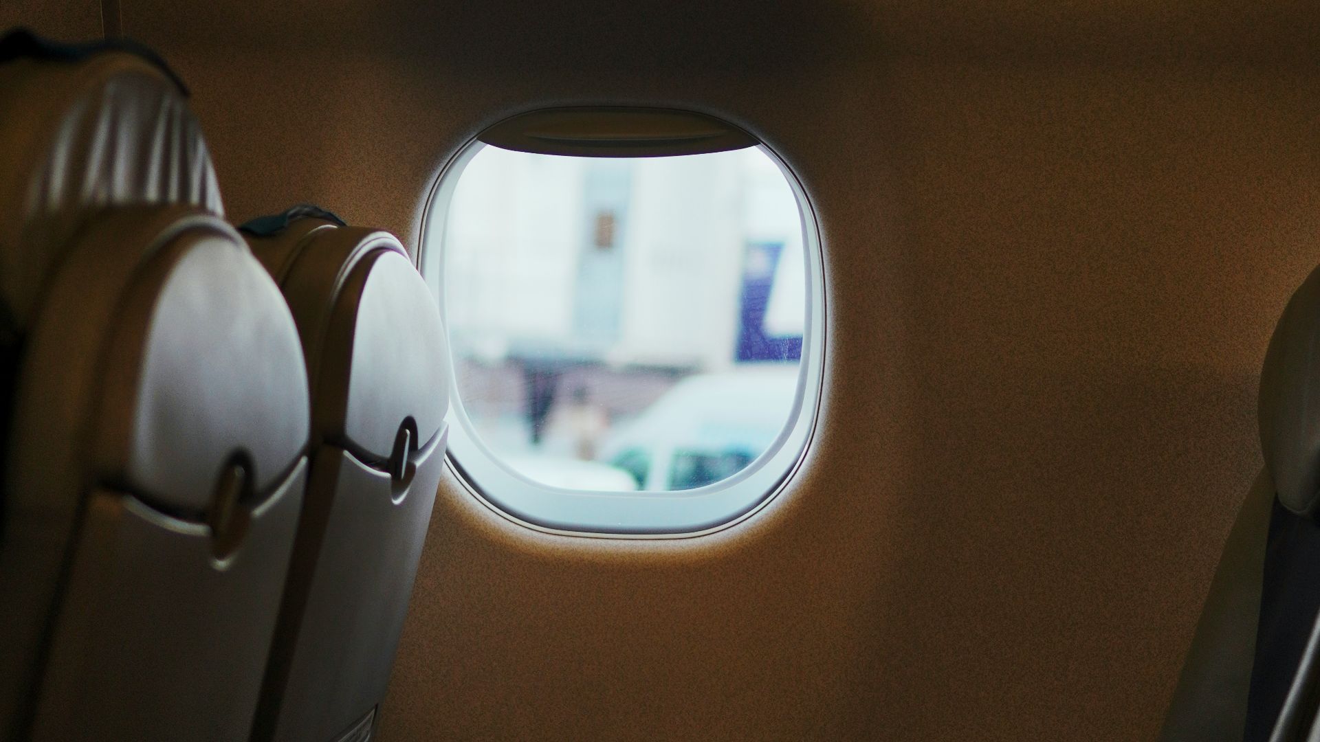 a view of the inside of an airplane looking out the window