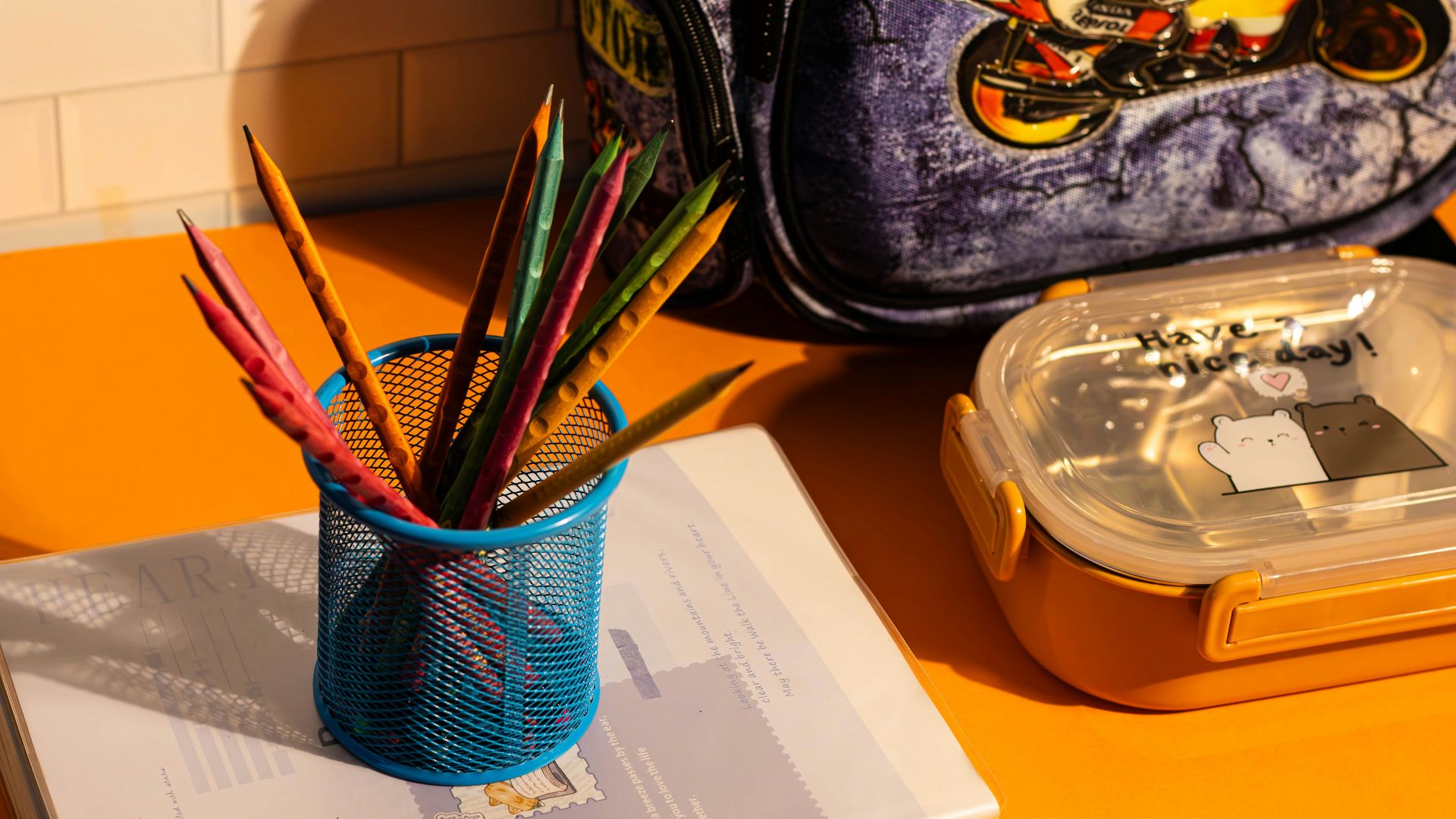 A blue backpack sitting on top of a yellow table