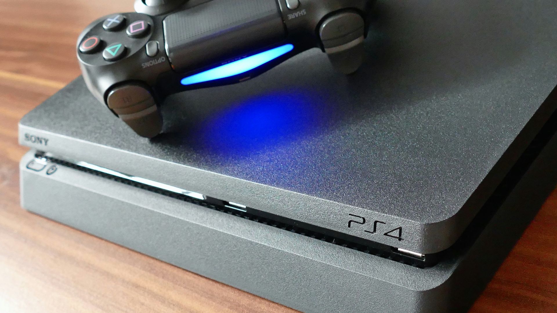 a video game console sitting on top of a wooden table
