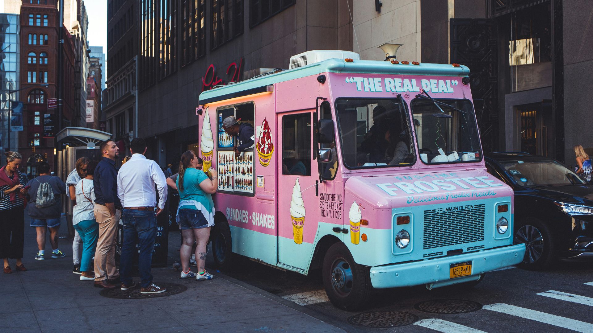 people walking on street during night time
