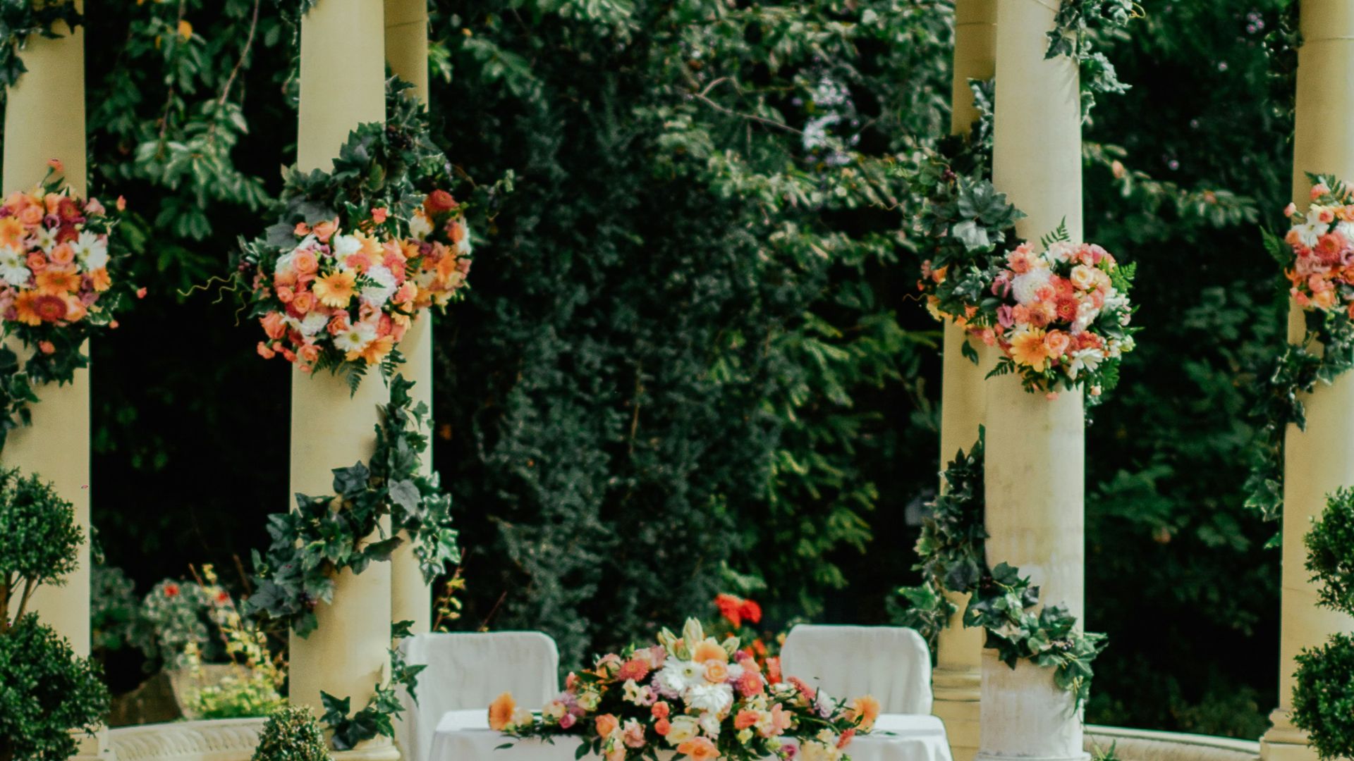 gray and beige gazebo near green leafed tree