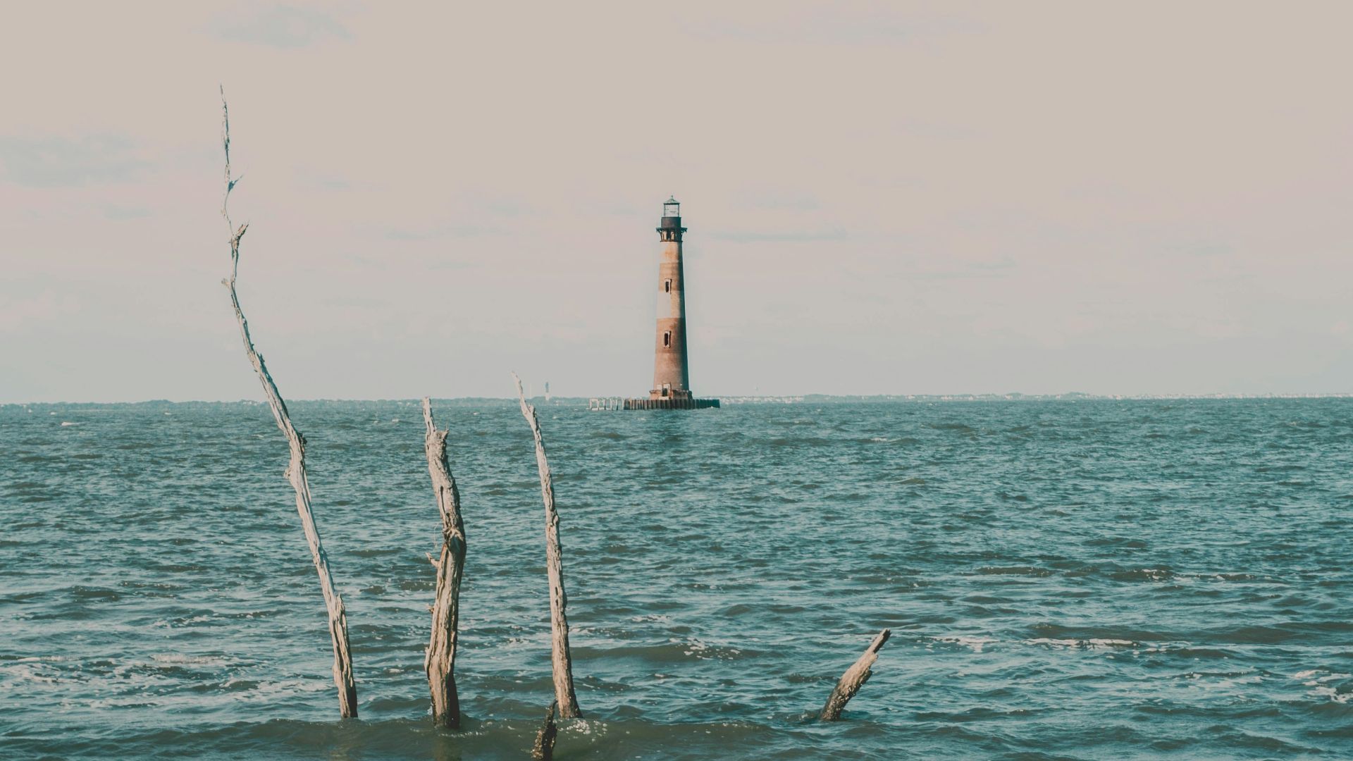 a light house in the middle of the ocean