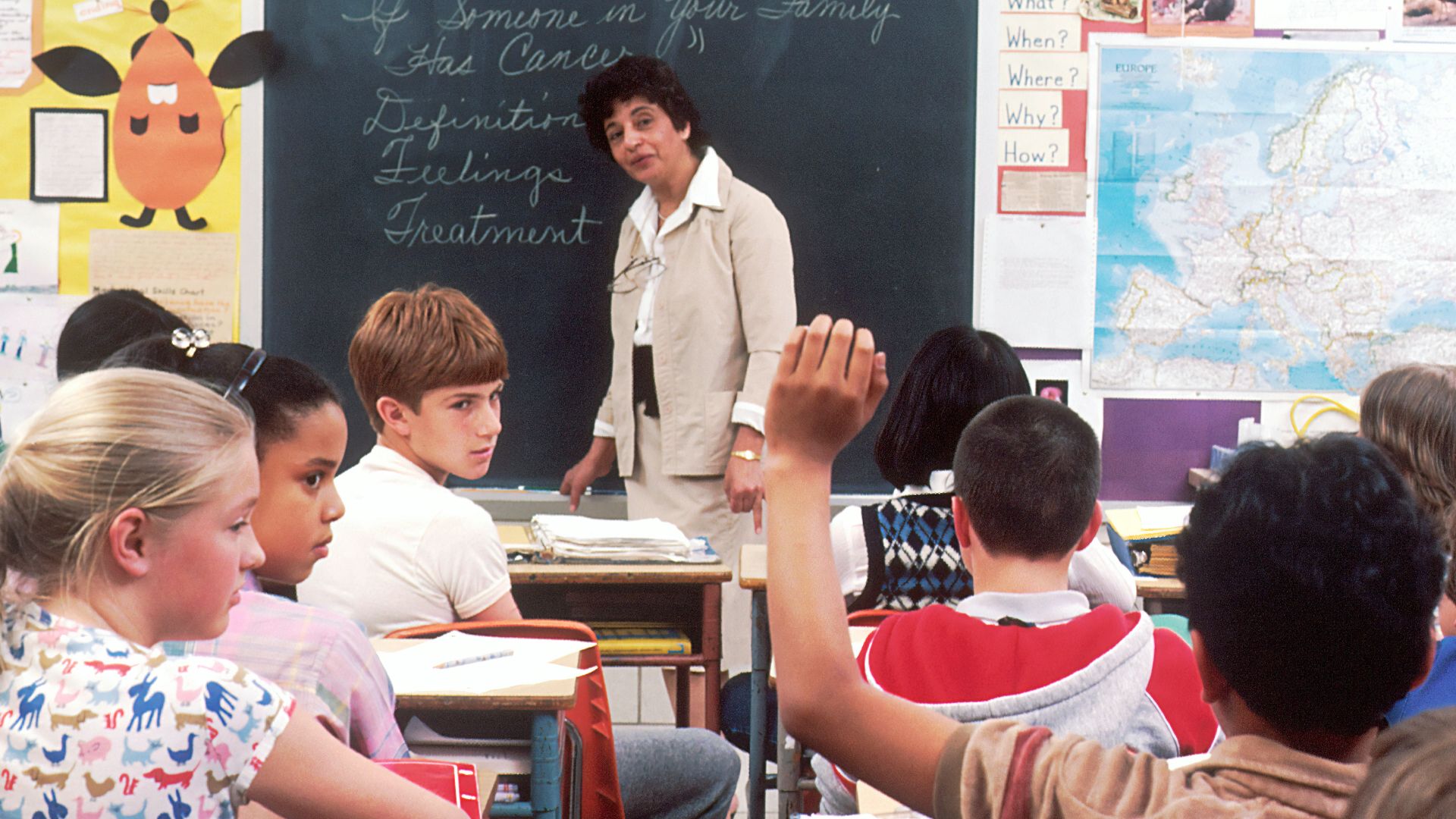 woman standing in front of children