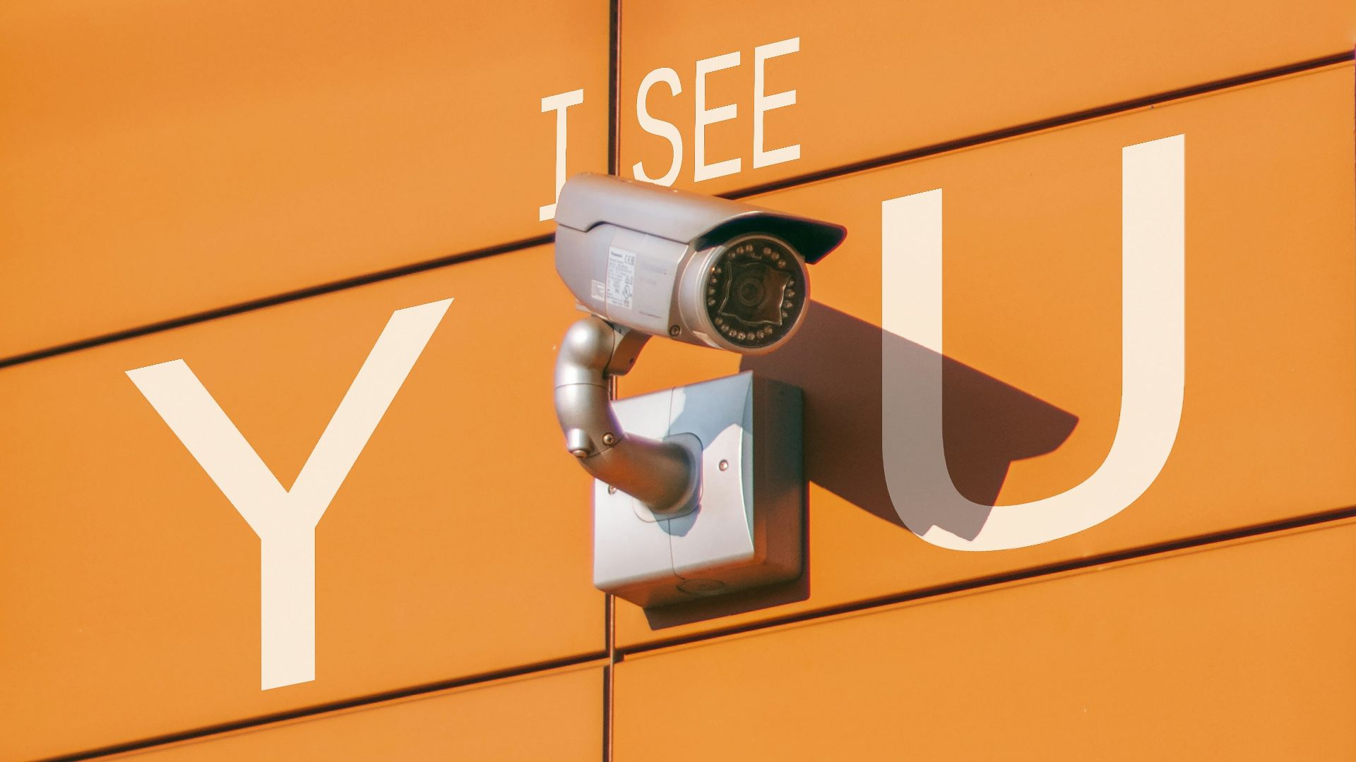 a security camera mounted to the side of a building