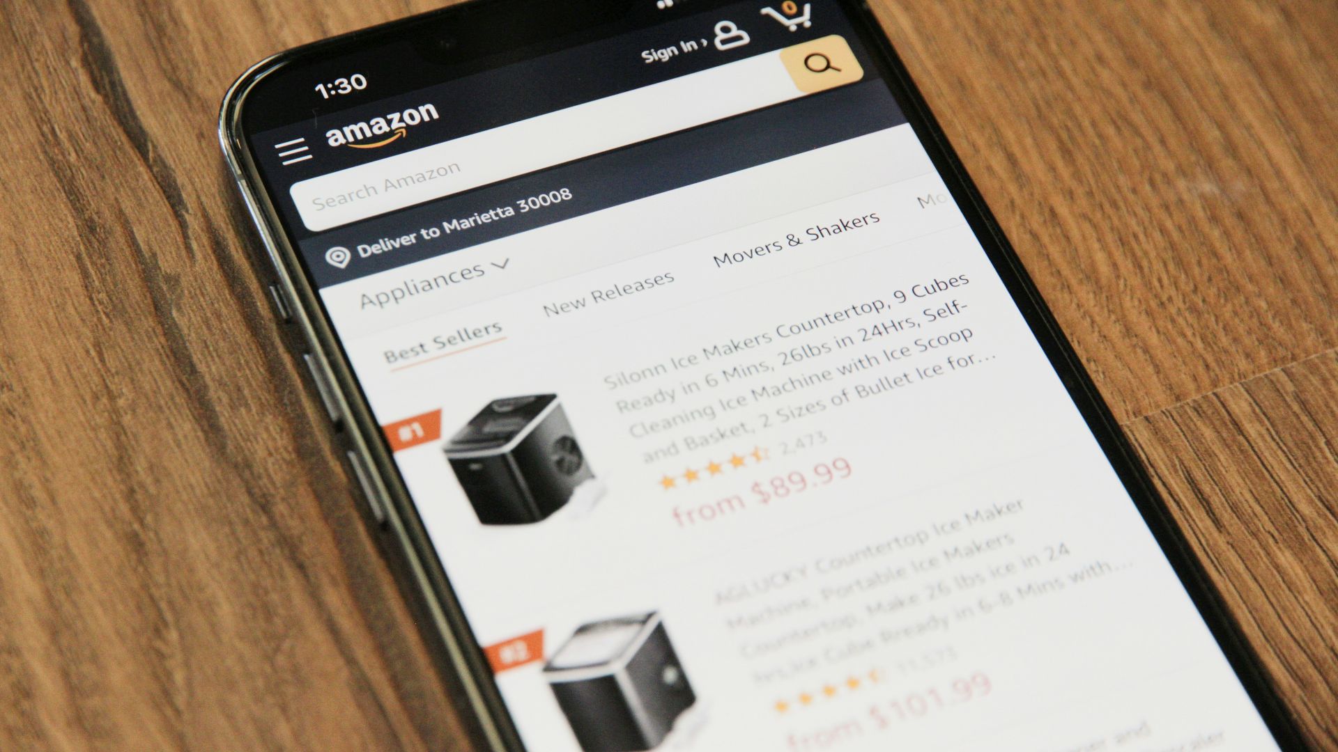 a cell phone sitting on top of a wooden table