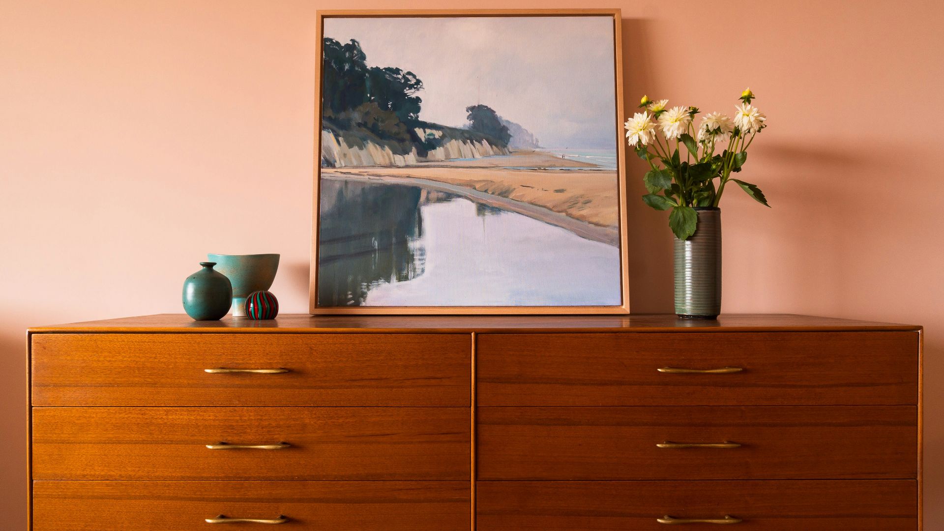 brown wooden drawer with painting