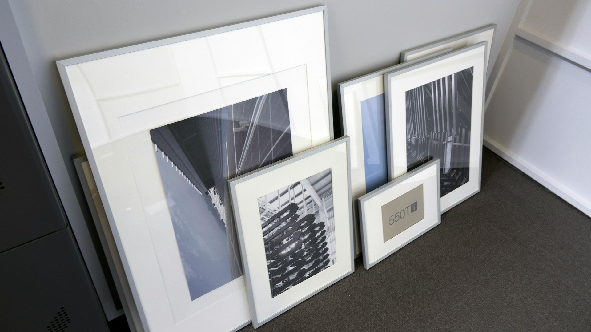 a group of three framed pictures sitting next to each other