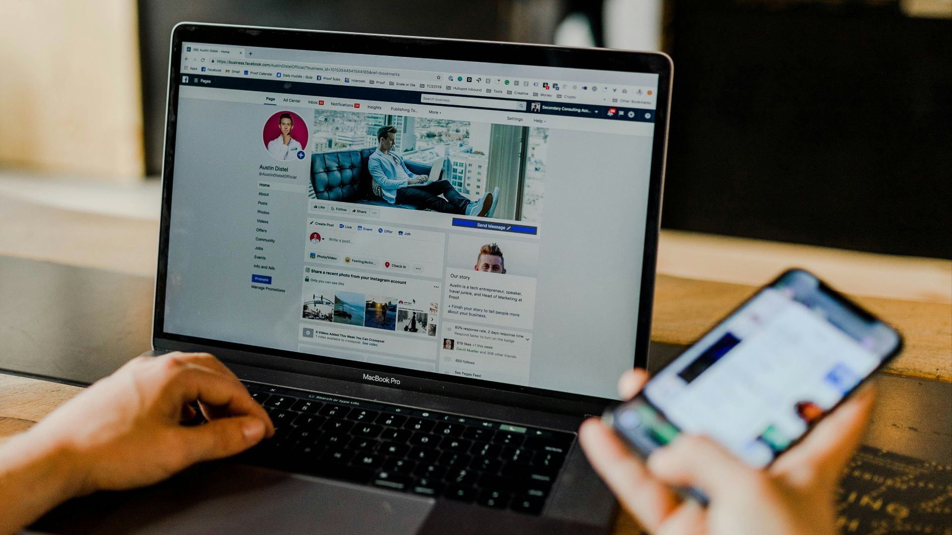 person using both laptop and smartphone