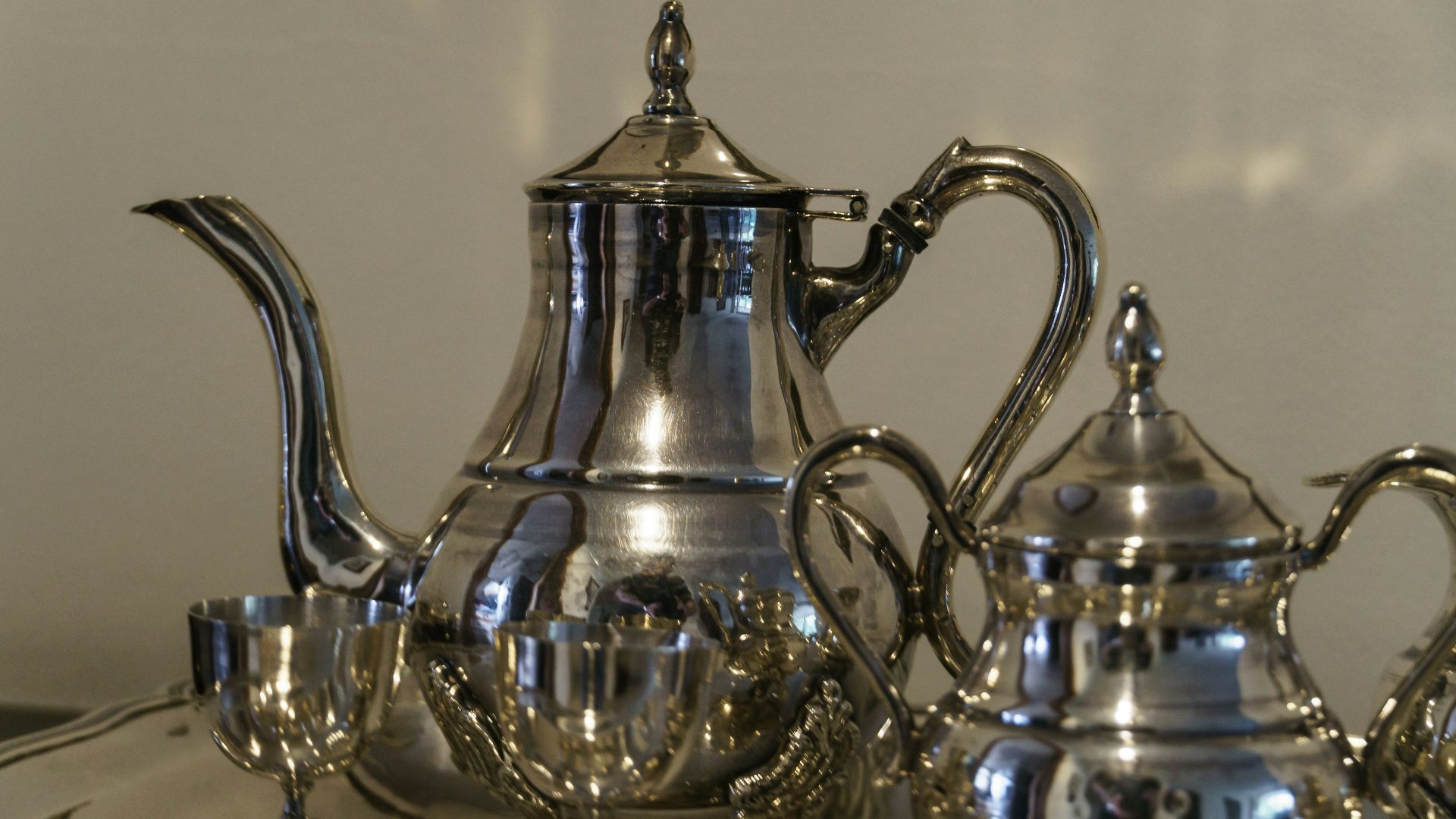 a tea kettle and glass